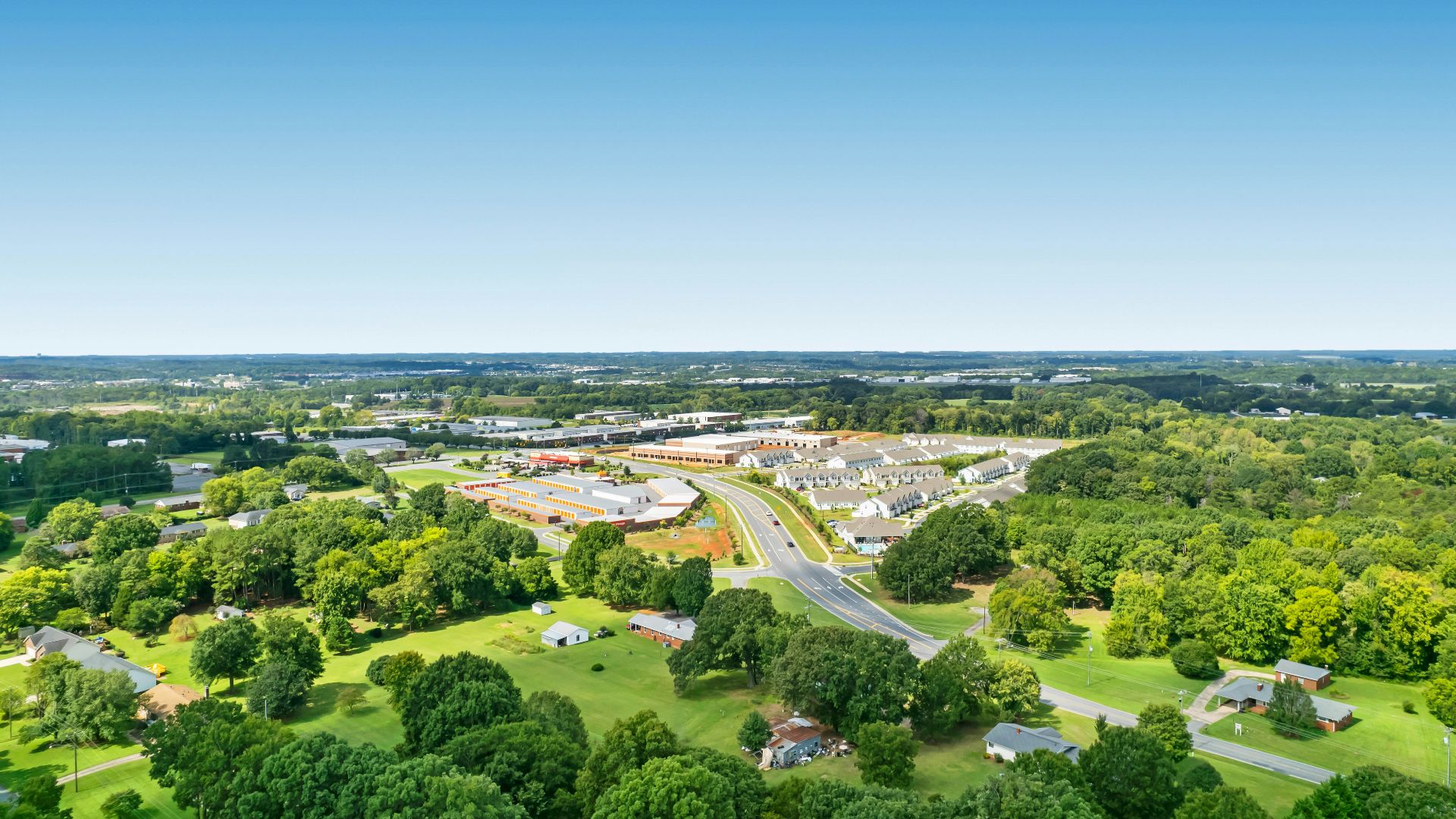 a landscape with trees and buildings