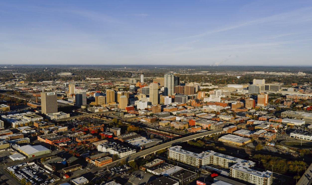 Aerial photograph showcasing Birmingham, Alabama's urban skyline and city layout