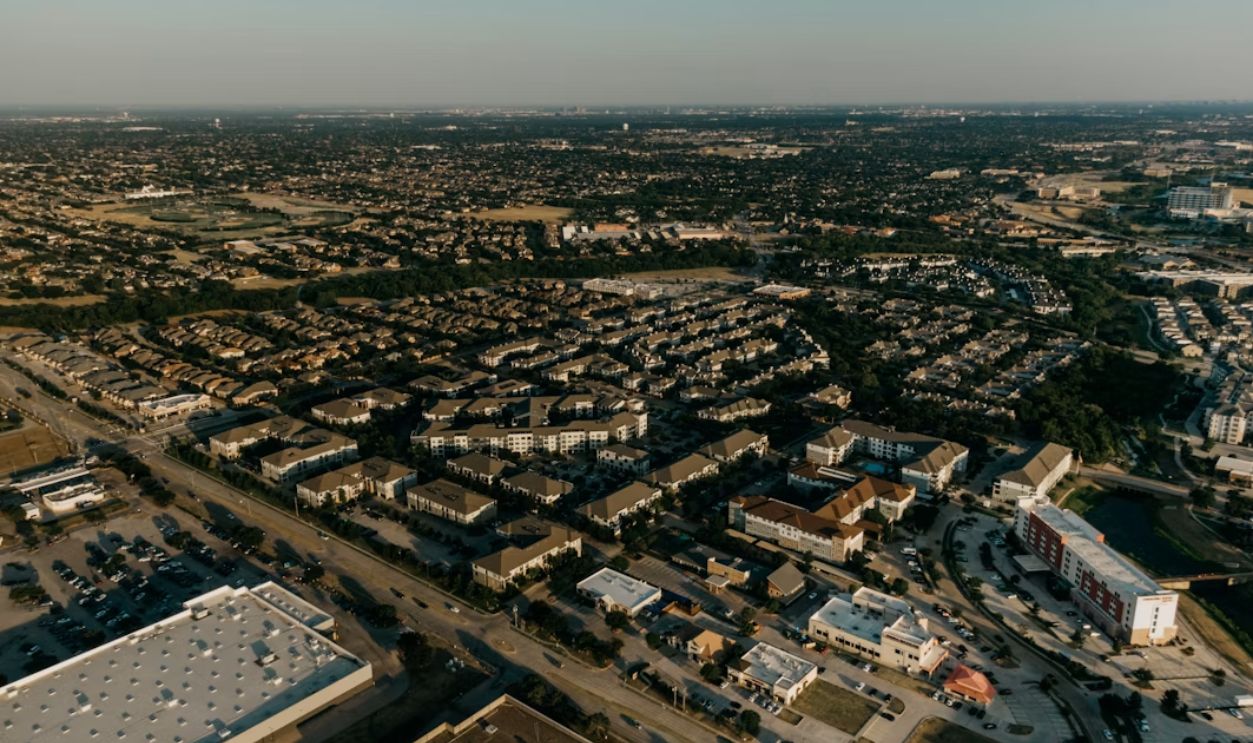 an aerial view of a city with lots of buildings