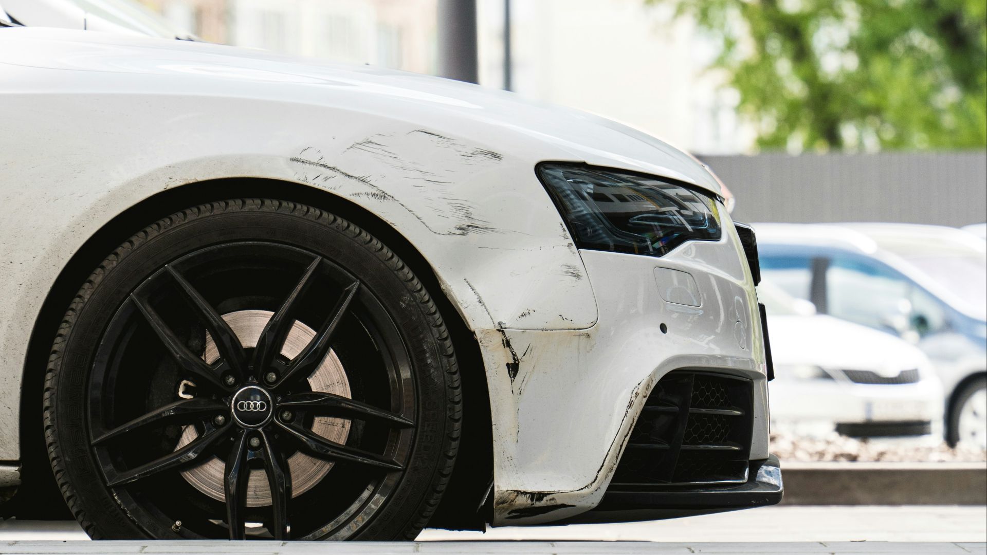 a white car parked on the side of the road