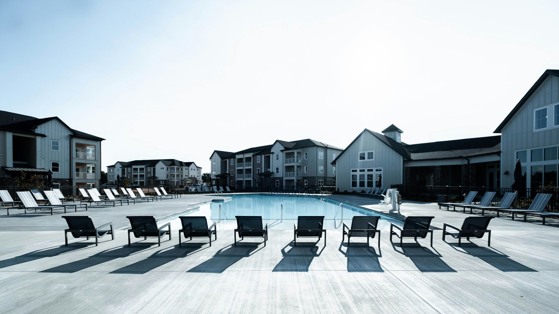 a pool with chairs around it