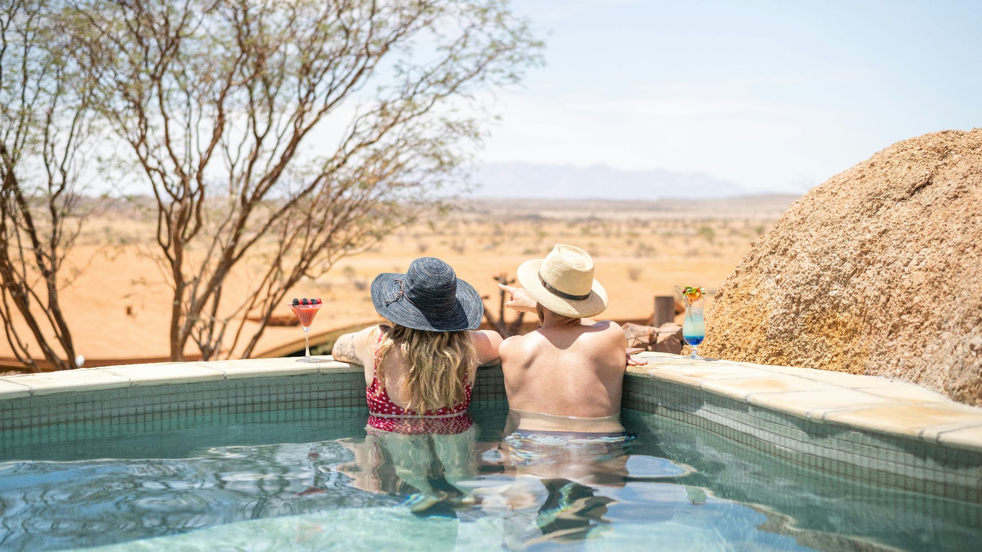 a couple of people that are in a pool