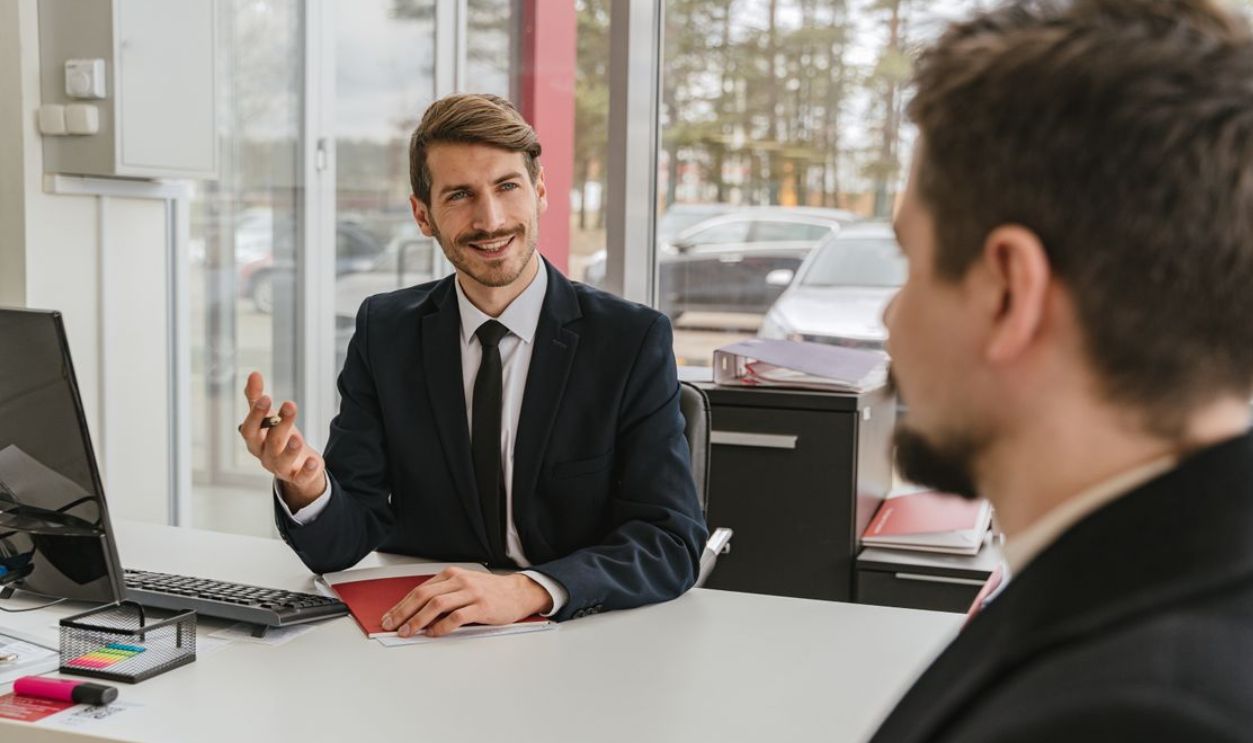 Two businessmen having a conversation in a modern office setting