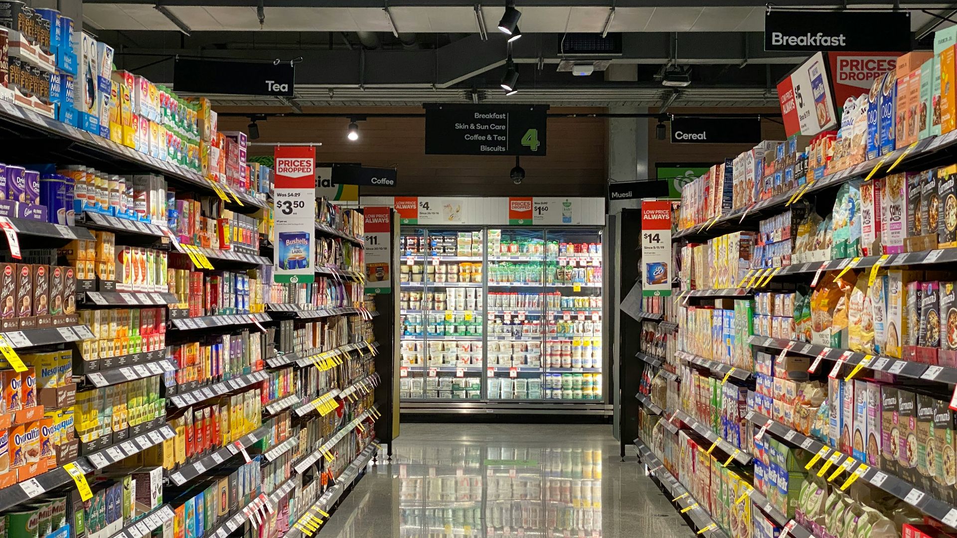 grocery store aisle with stocked shelves