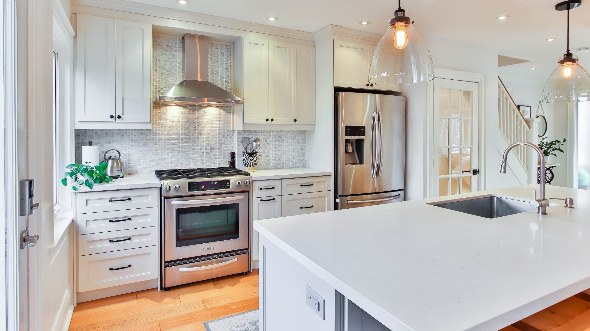 white wooden kitchen cabinet and white kitchen counter