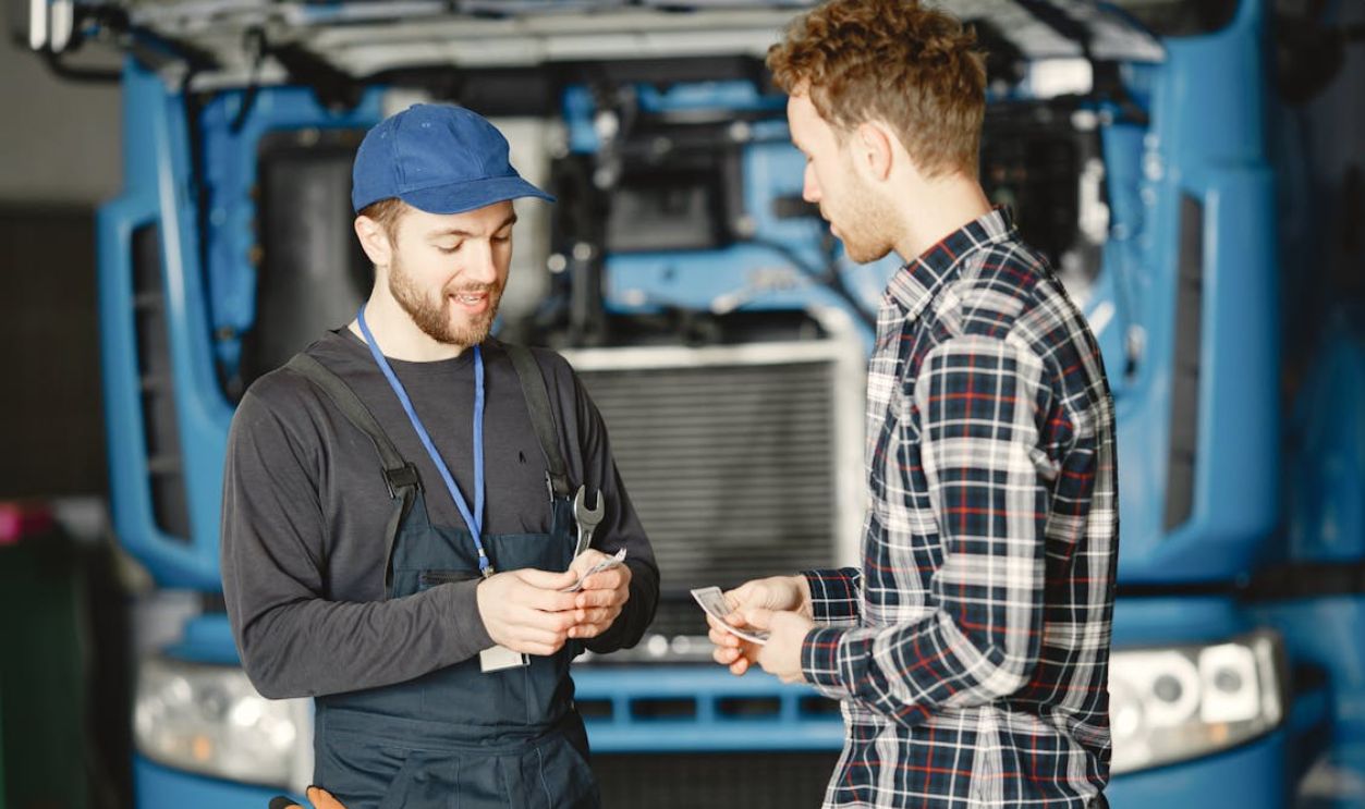 Man talking to a mechanic