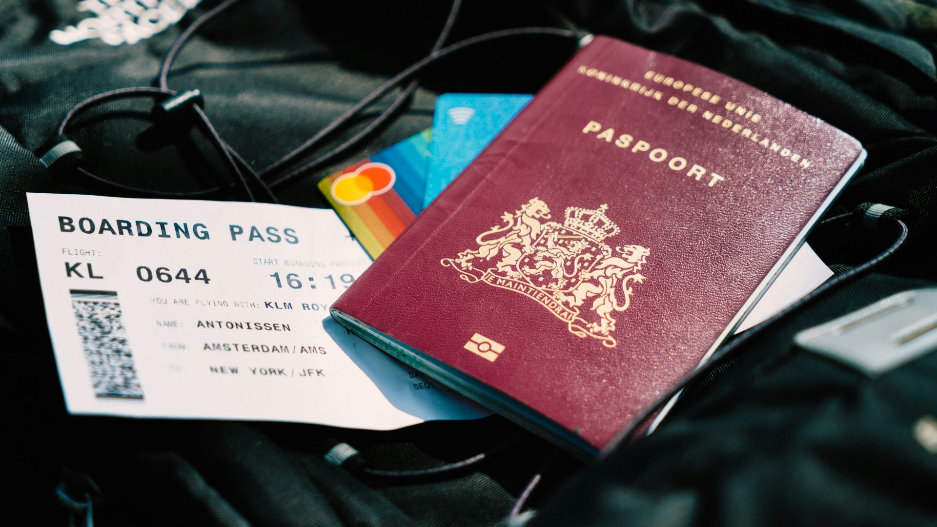 a passport and a boarding pass are on a bag