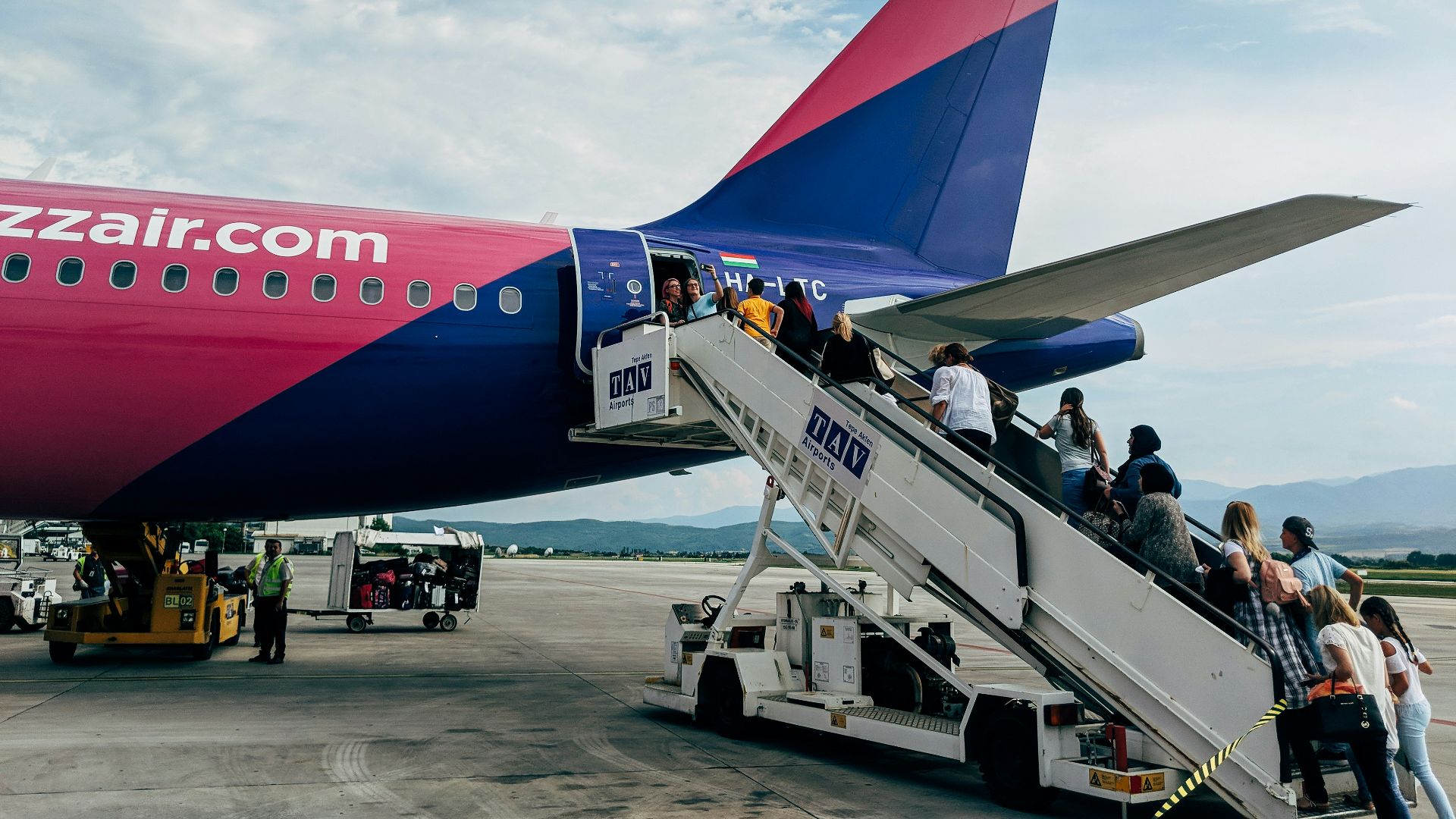 people walking towards airplane