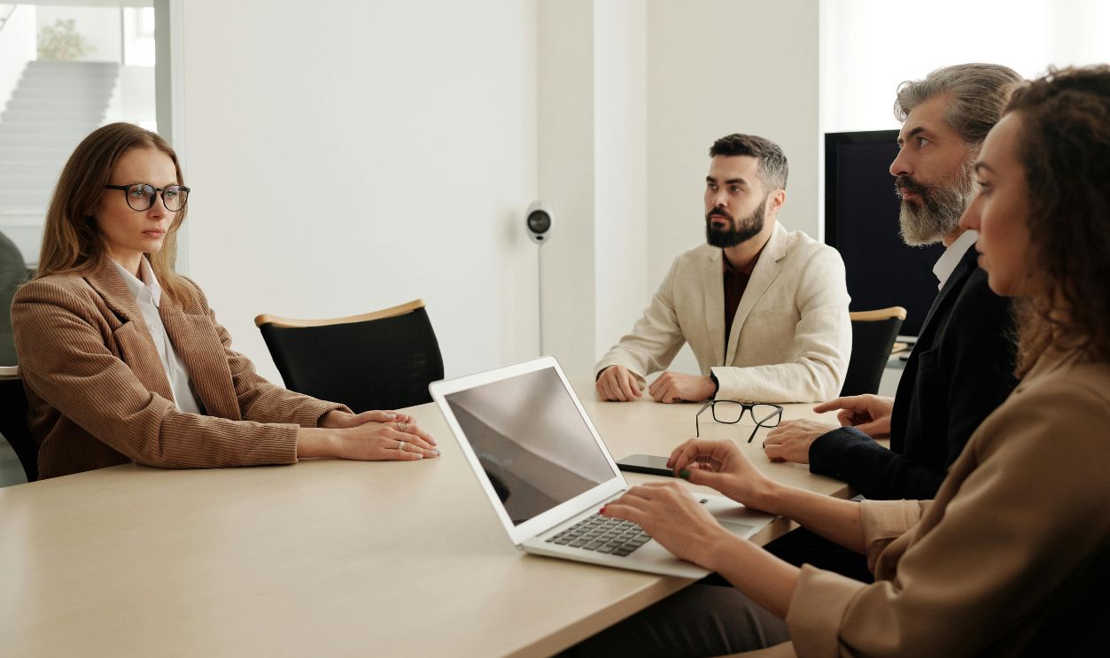 Business meeting with diverse team in modern office setting