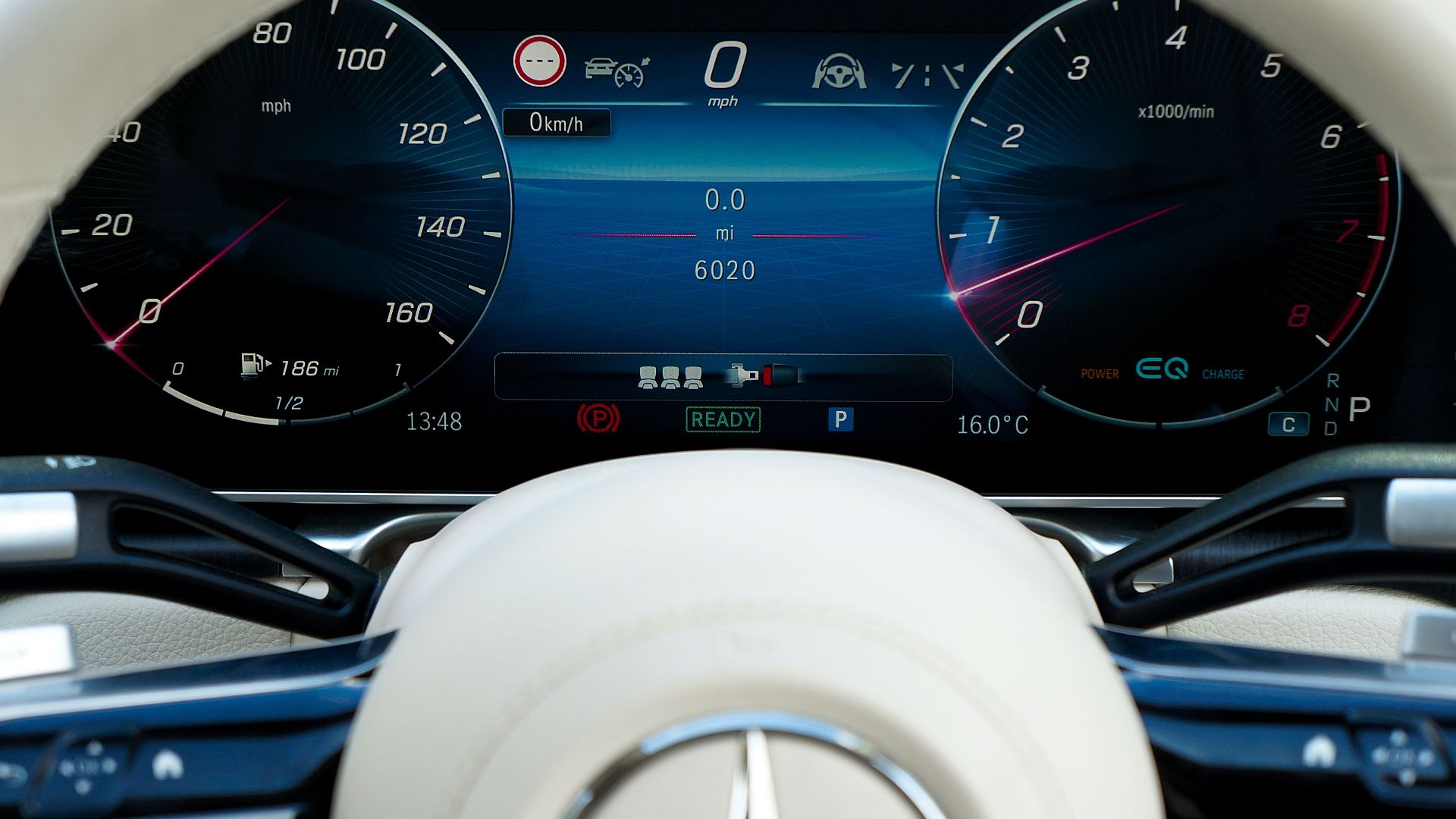 Close-up of a modern car dashboard showcasing digital gauges and technology.