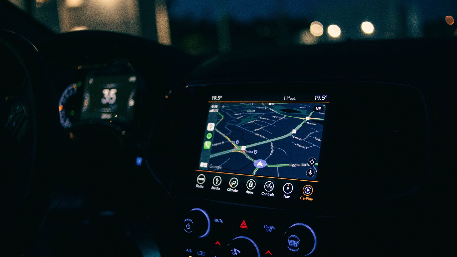 Interior view of a car featuring the GPS navigation system illuminated at night, showcasing technology and modern travel.