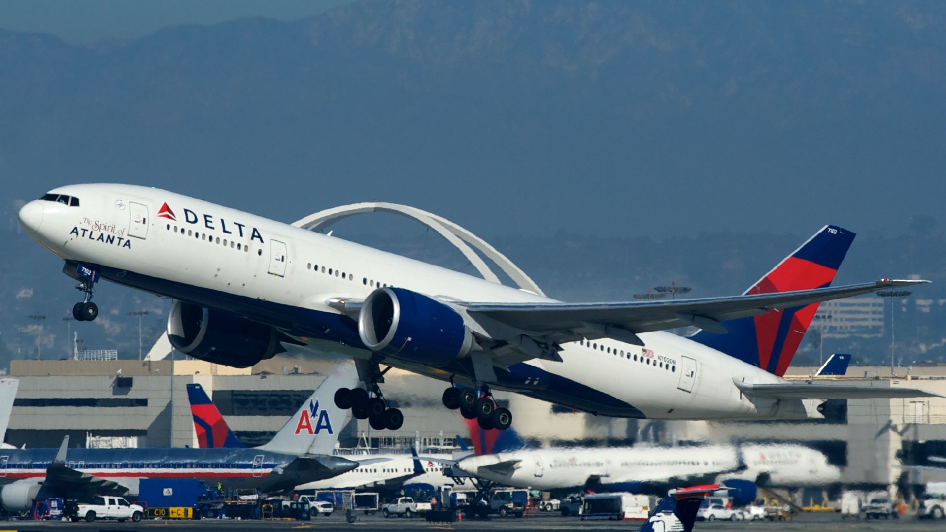 The Spirit of Atlanta departing LAX. AeroMexico Connect ERJ-145 XA-TAC waiting to taxi.