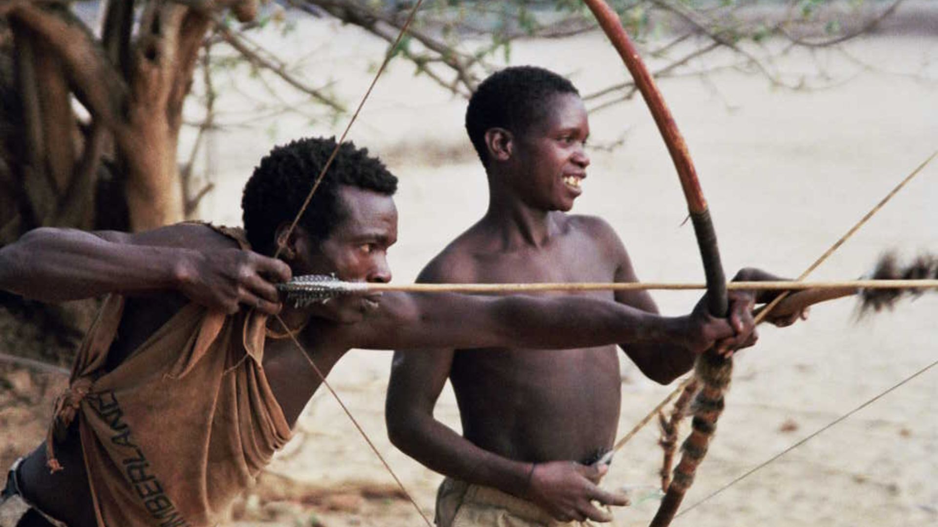 Hadzabe Men Practicing Bowing