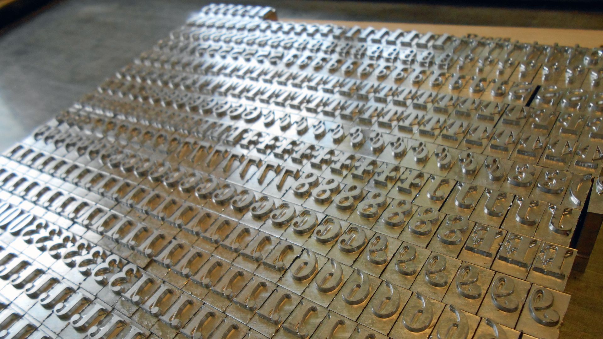 A close up view of the 36 pt Cherokee syllabary printing type. Syllabary mixed with standard numbers. Photographed at Southwestern Community College, Bryson City, NC.