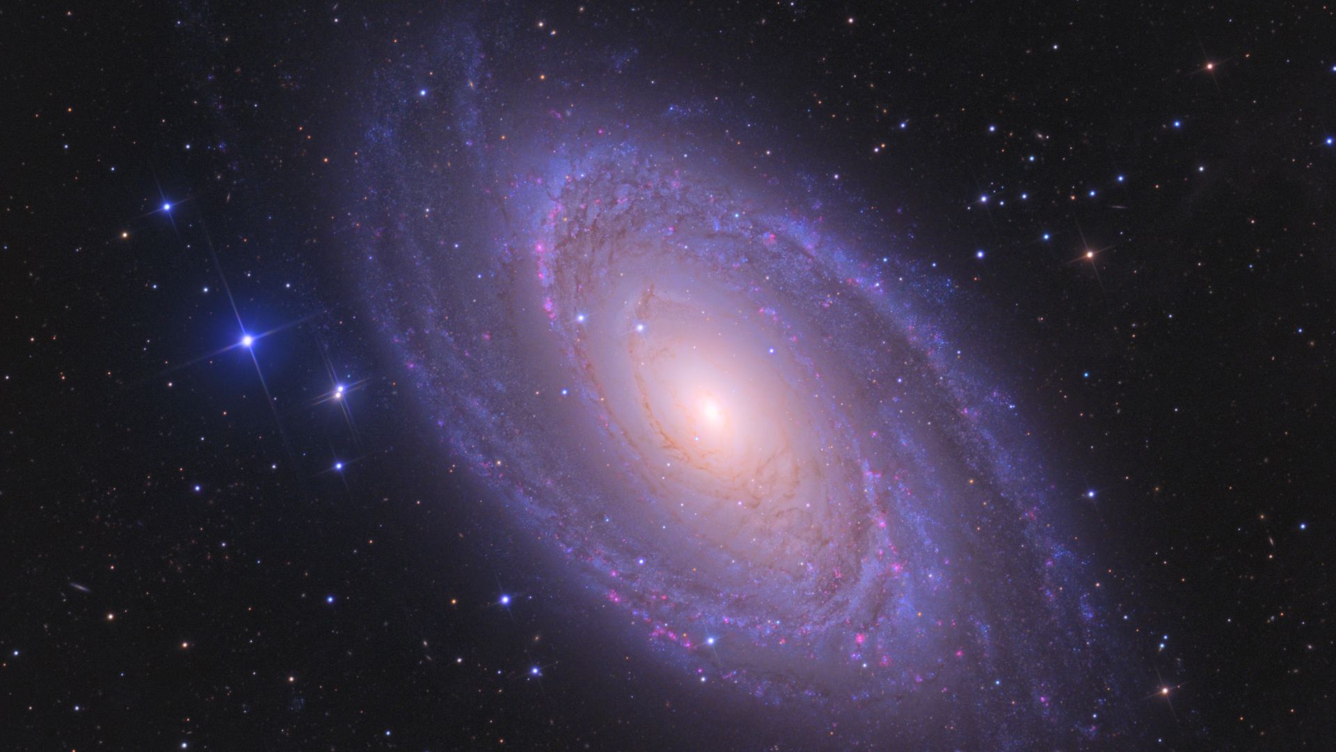 M81 also known as Bode's Galaxy is around 12 million light years away. It has an irregular satellite galaxy known as Holmberg IX.