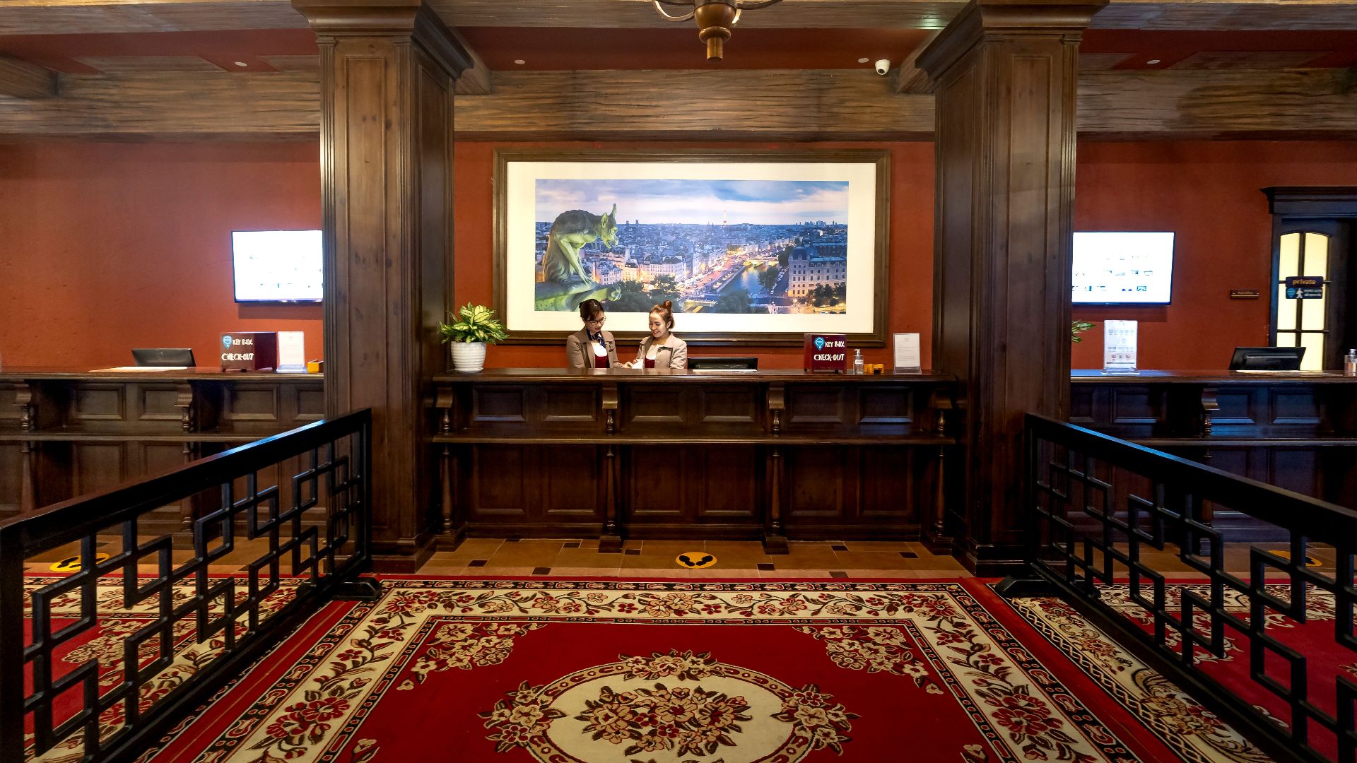 Elegant and luxurious hotel reception with classic wooden design and plush carpeting.