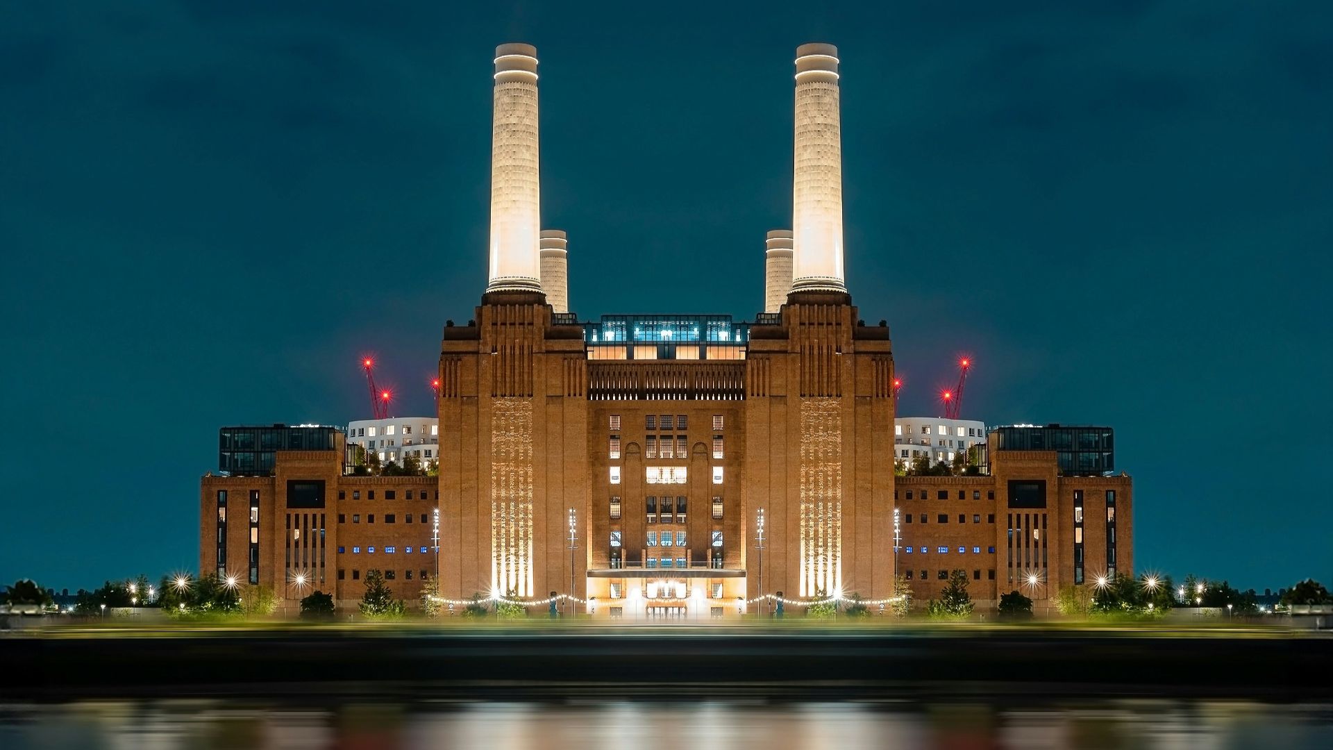 a large building with two towers lit up at night