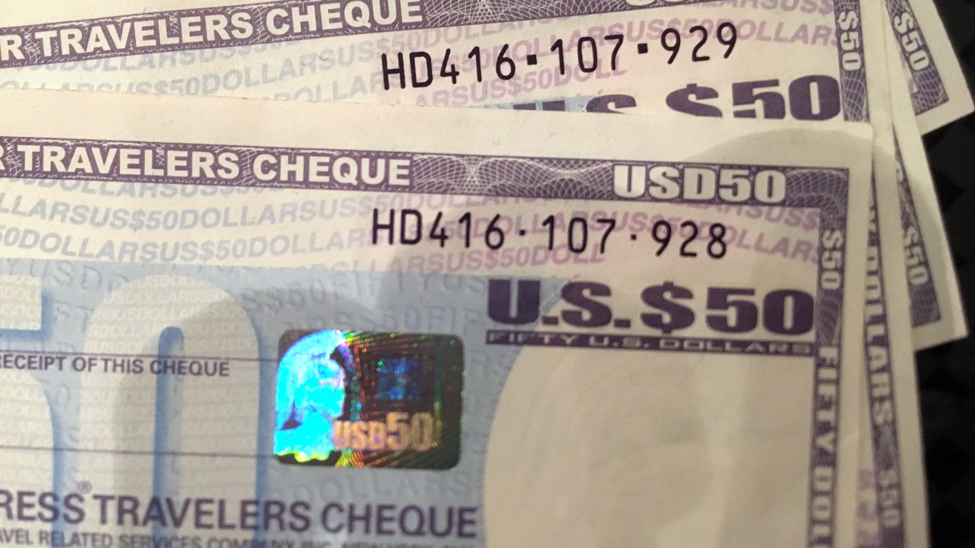 Four Travelers Cheques of 50 USD each, issued by American Express, bought ca. 2012, have long been spent. Soon after the photo was taken in 2016, they were changed back to cash.