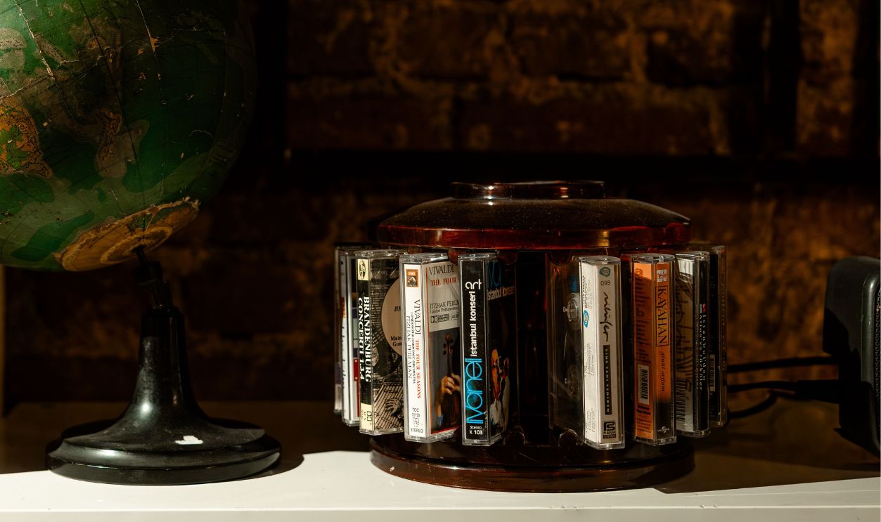 A nostalgic arrangement of a globe and cassette tapes