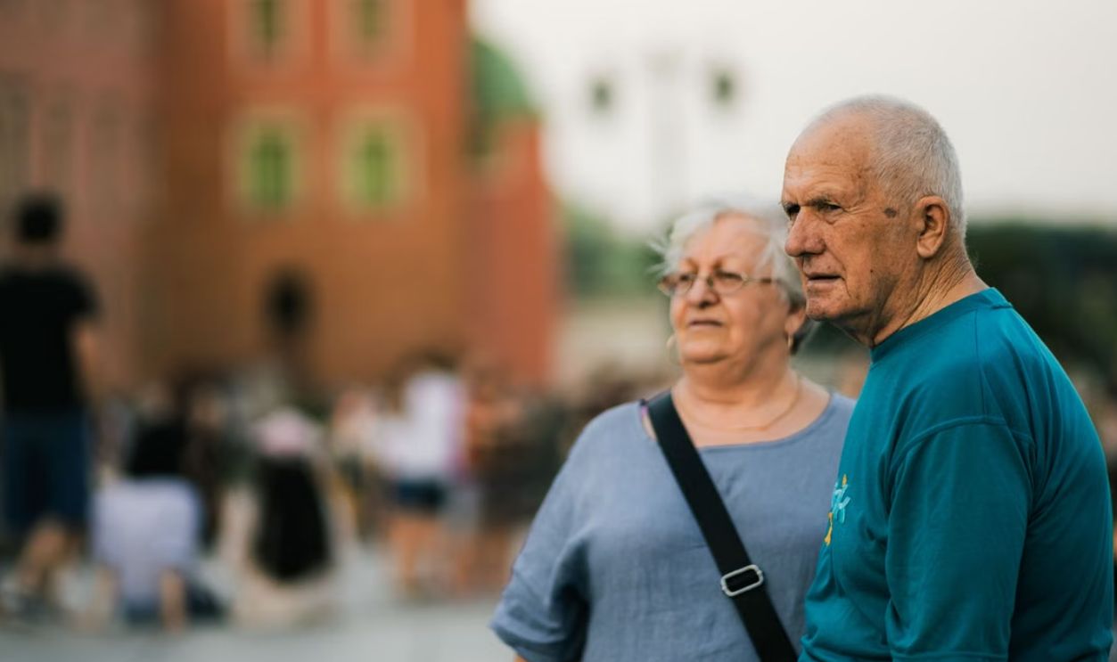 Senior couple enjoying a day out in a bustling city setting
