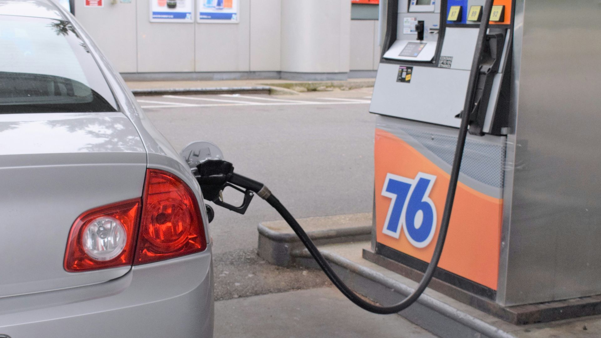 a car is parked at a gas pump