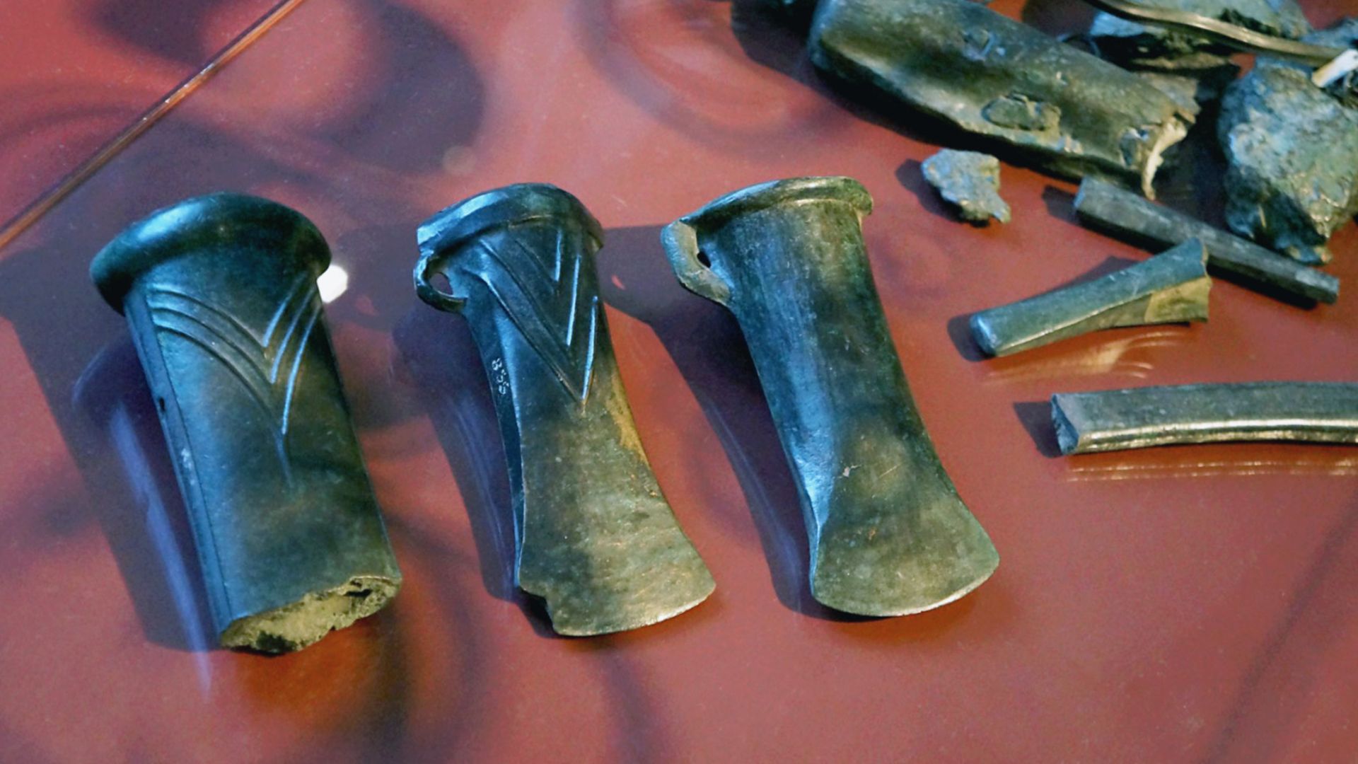 Bronze Age cabinet 02, museum Zrenjanin: Hoard – ornamental articles, fibulas, bracelets, earrings, needles, buttons, tools, sickles, celtic axes, weapons, spearheads, raw materials for making bronze objects. Locality: Šimutska Strana, Novi Bečej. Late Br