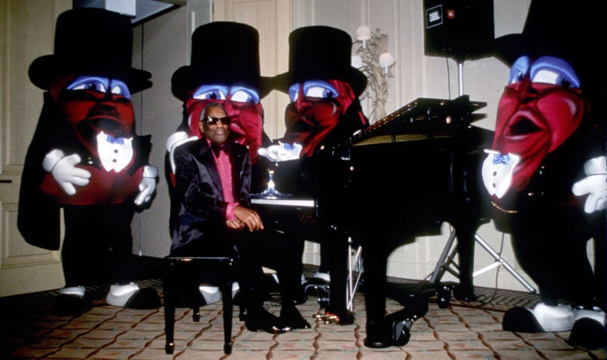 LOS ANGELES - 1986: Entertainer and singer Ray Charles poses for a portrait with the California Raisins during the 