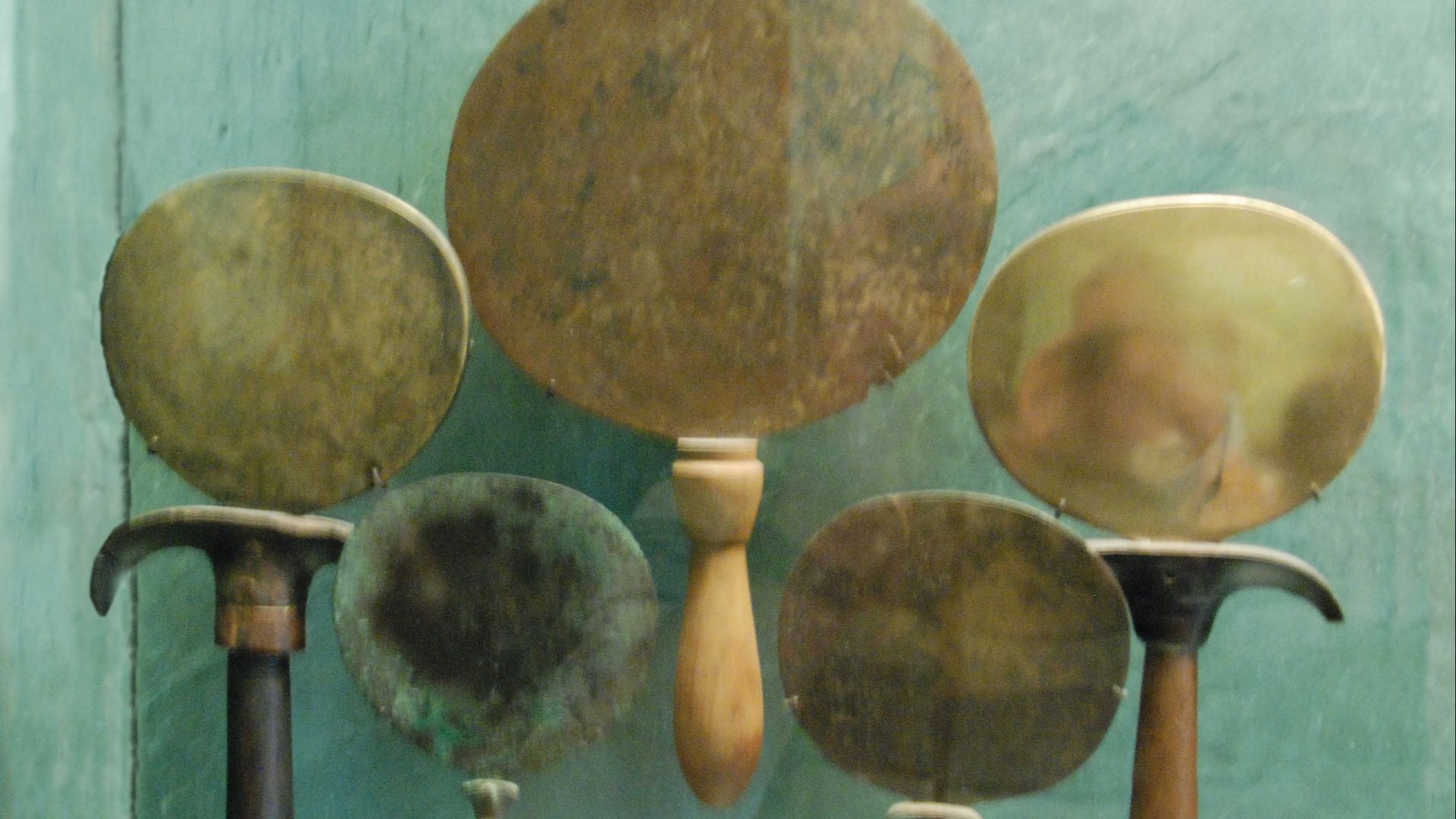1,5 - Mirror in form of papyrus. 2 - Mirror in the form of a young girl. 3 - Mirror. 4 - Round mirror in form of papyrus.