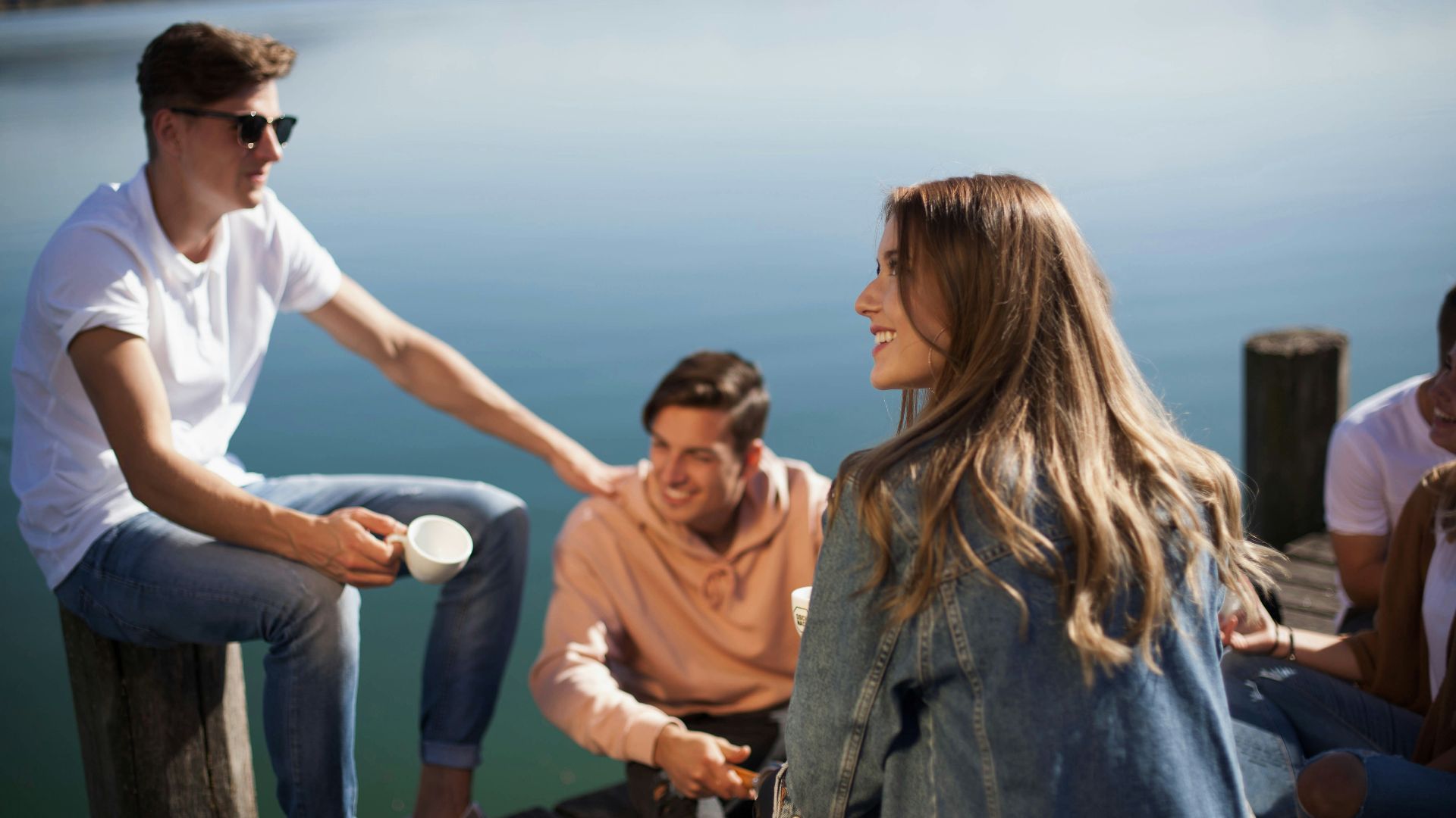 group of people sitting on boat dock