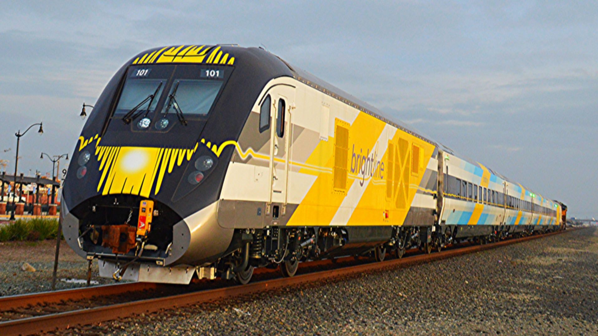 The first of five train sets for Brightline is hauled by the Union Pacific Railroad through Manteca, California on the Fresno Subdivision in December 2016 on its way to Florida