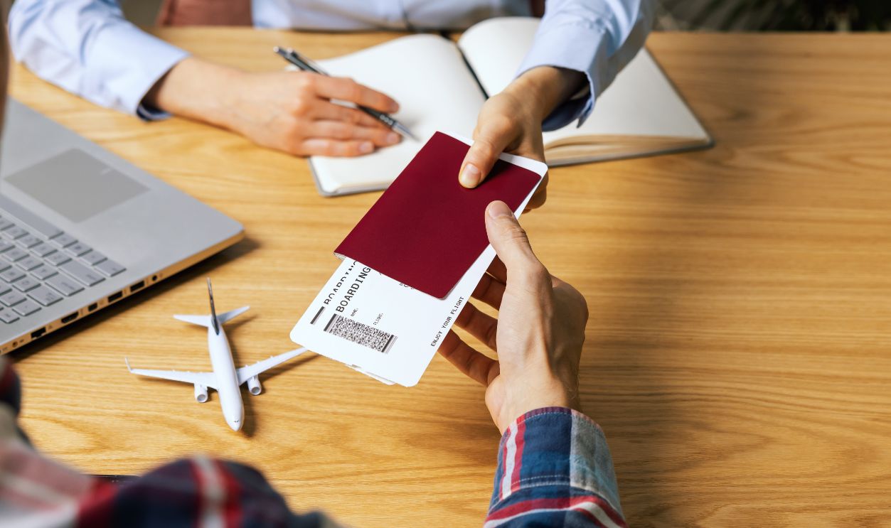 customer buying flight tickets in travel agency for his next trip