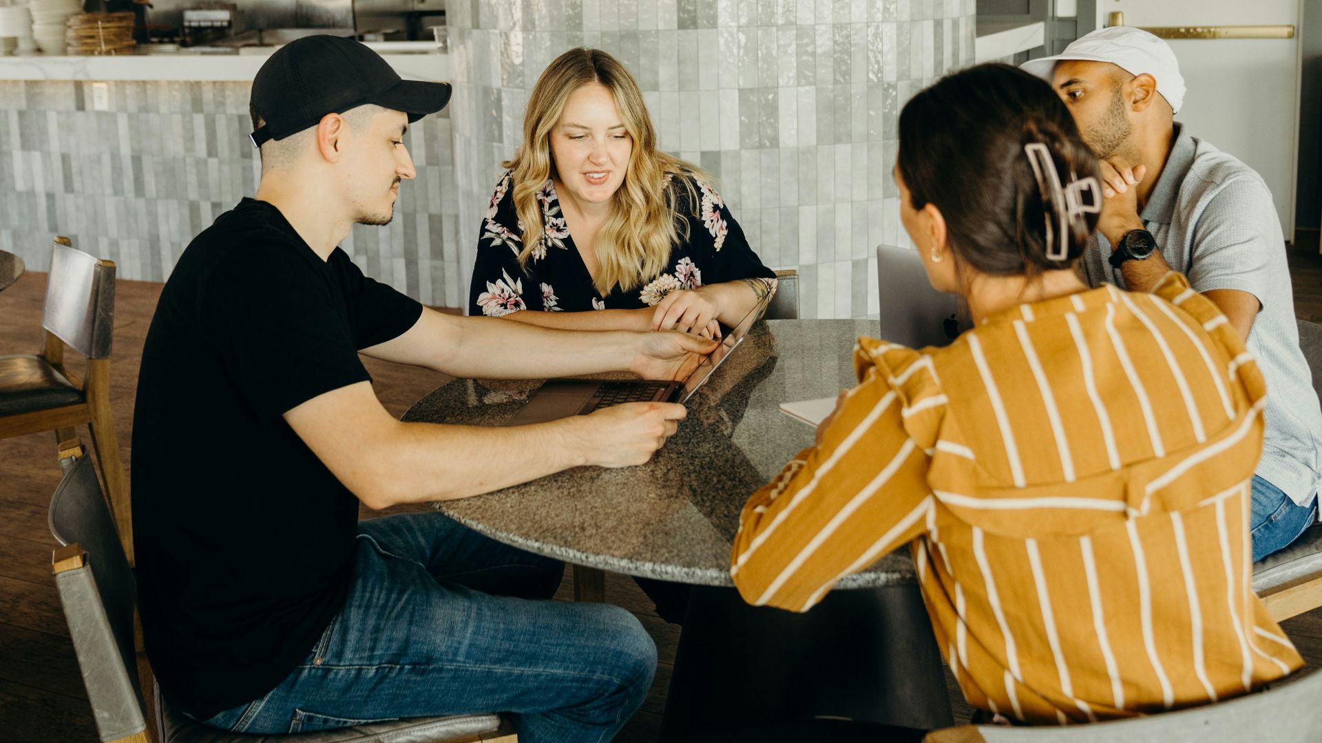 a group of people sitting around a table