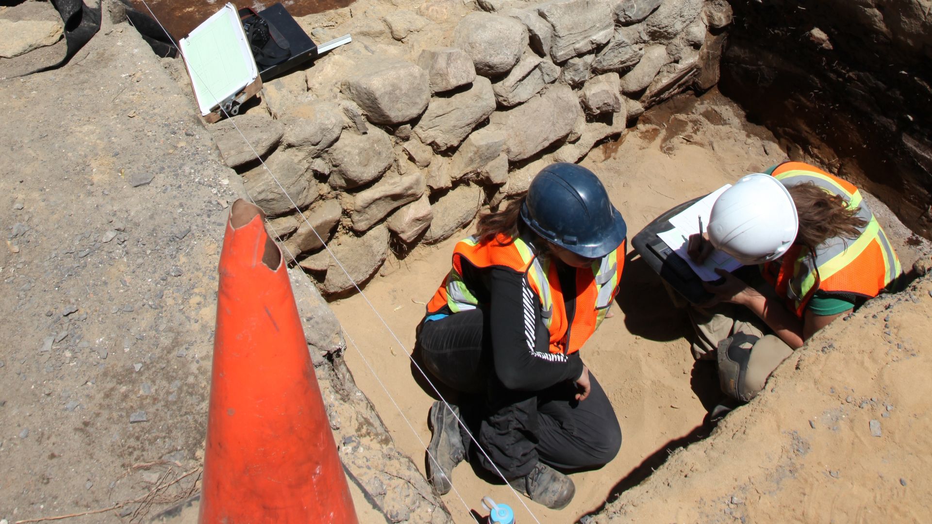 A half-excavated foundation wall, made out of field stones in 18th century during an archaeological excavation in Ancienne Lorette near Quebec City, Canada.