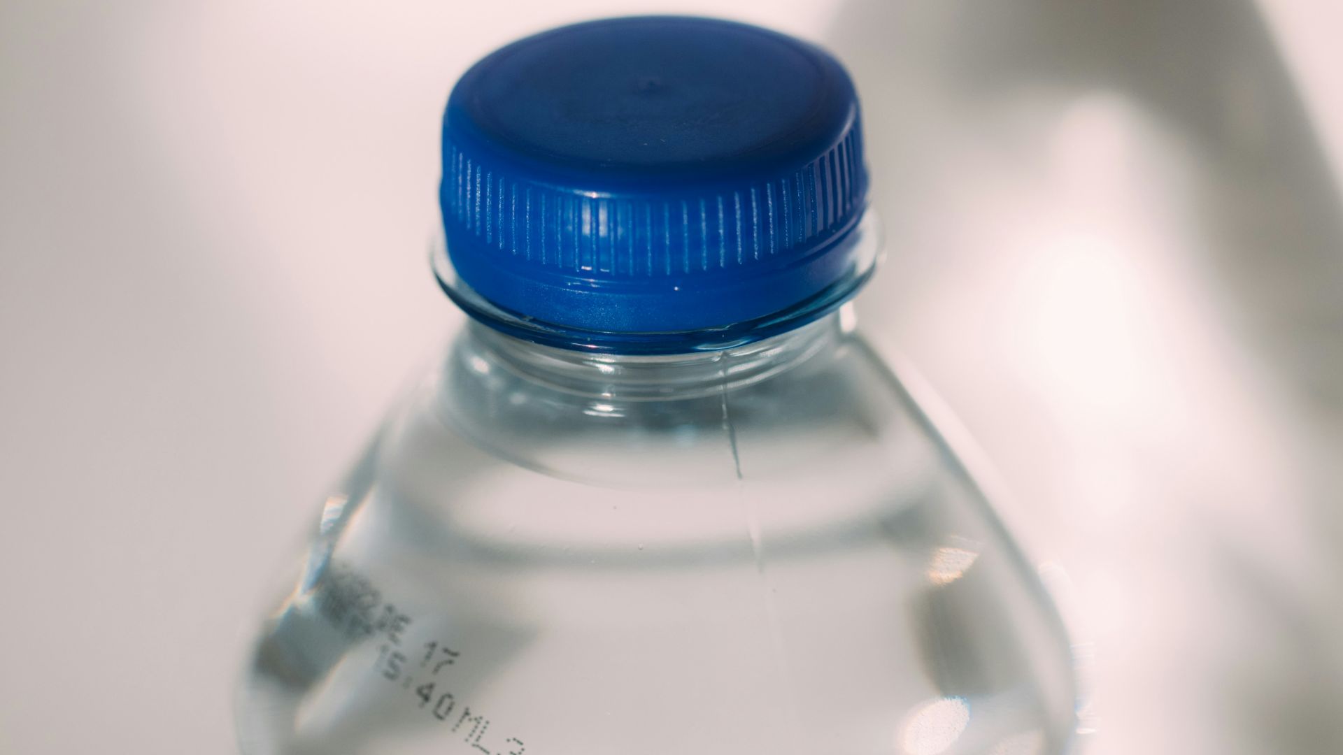blue lid clear plastic bottle