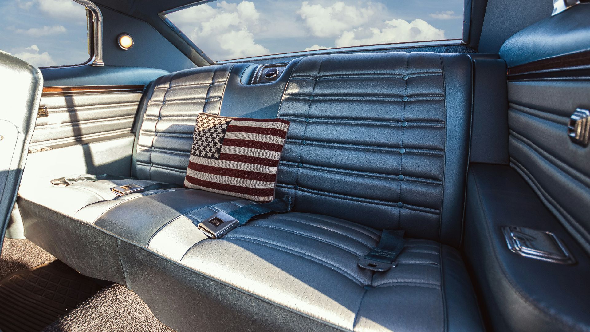 The interior of a car with a flag on the seat