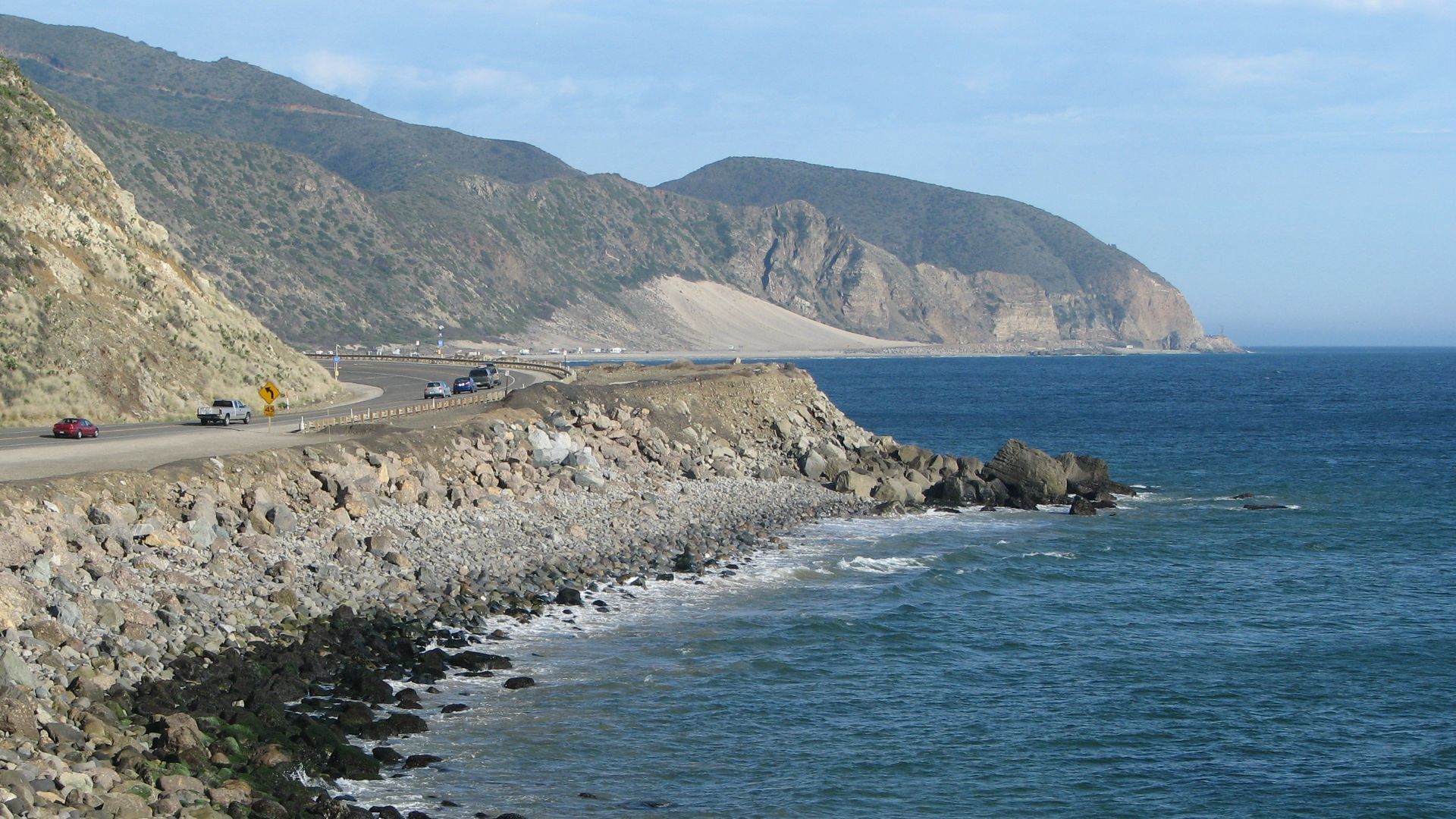 California State Route 1—Pacific Coast Highway — view towards Point Mugu State Park near Point Mugu, at the Santa Monica Mountains coast.
Located in southeastern Ventura County, Southern California.
