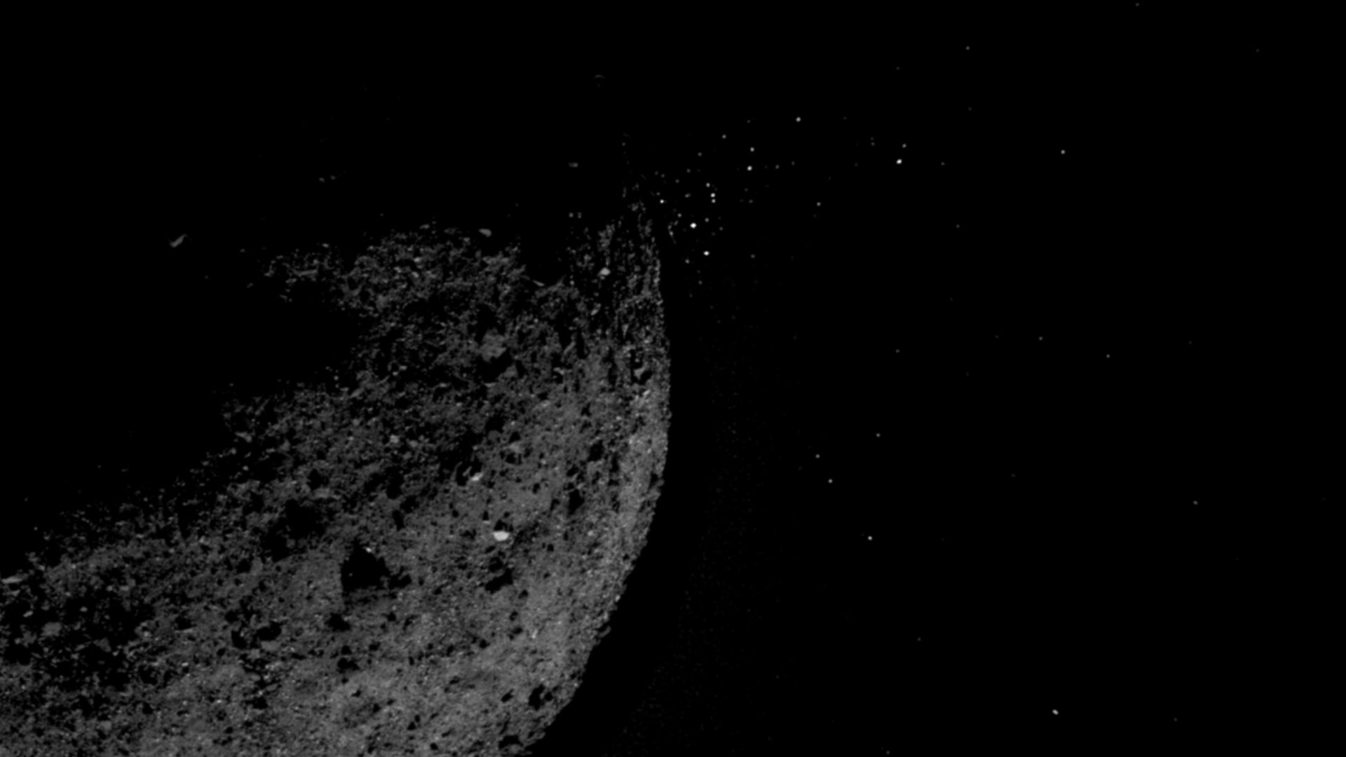 This view of asteroid Bennu ejecting particles from its surface on January 19 was created by combining two images taken by the NavCam 1 imager onboard NASA’s OSIRIS-REx spacecraft: a short exposure image (1.4 ms), which shows the asteroid clearly, and a l
