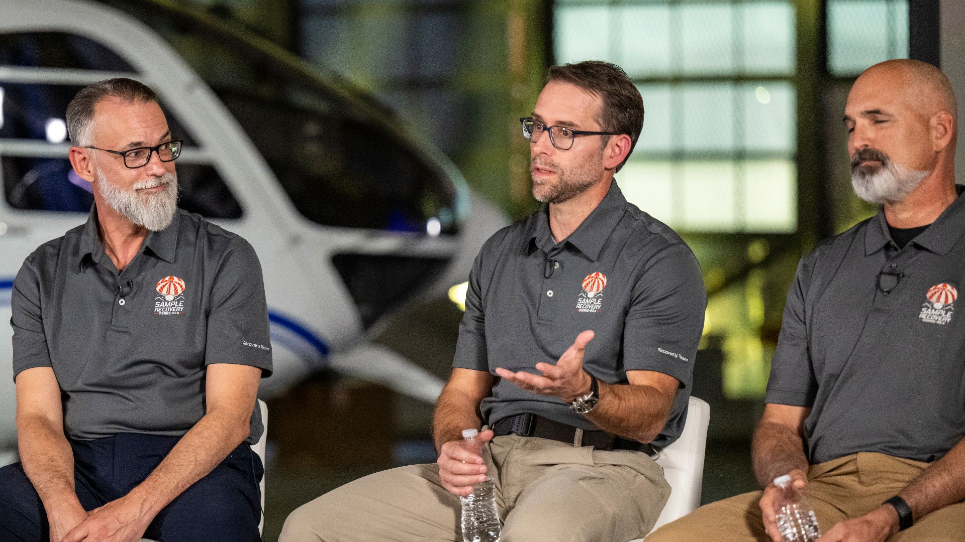 NASA OSIRIS-REx Deputy Project Manager Mike Moreau, center, answers questions from reporters during an OSIRIS-REx sample return press conference, Sunday, Sept. 24, 2023, shortly after the capsule landed at the Department of Defense's Utah Test and Trainin