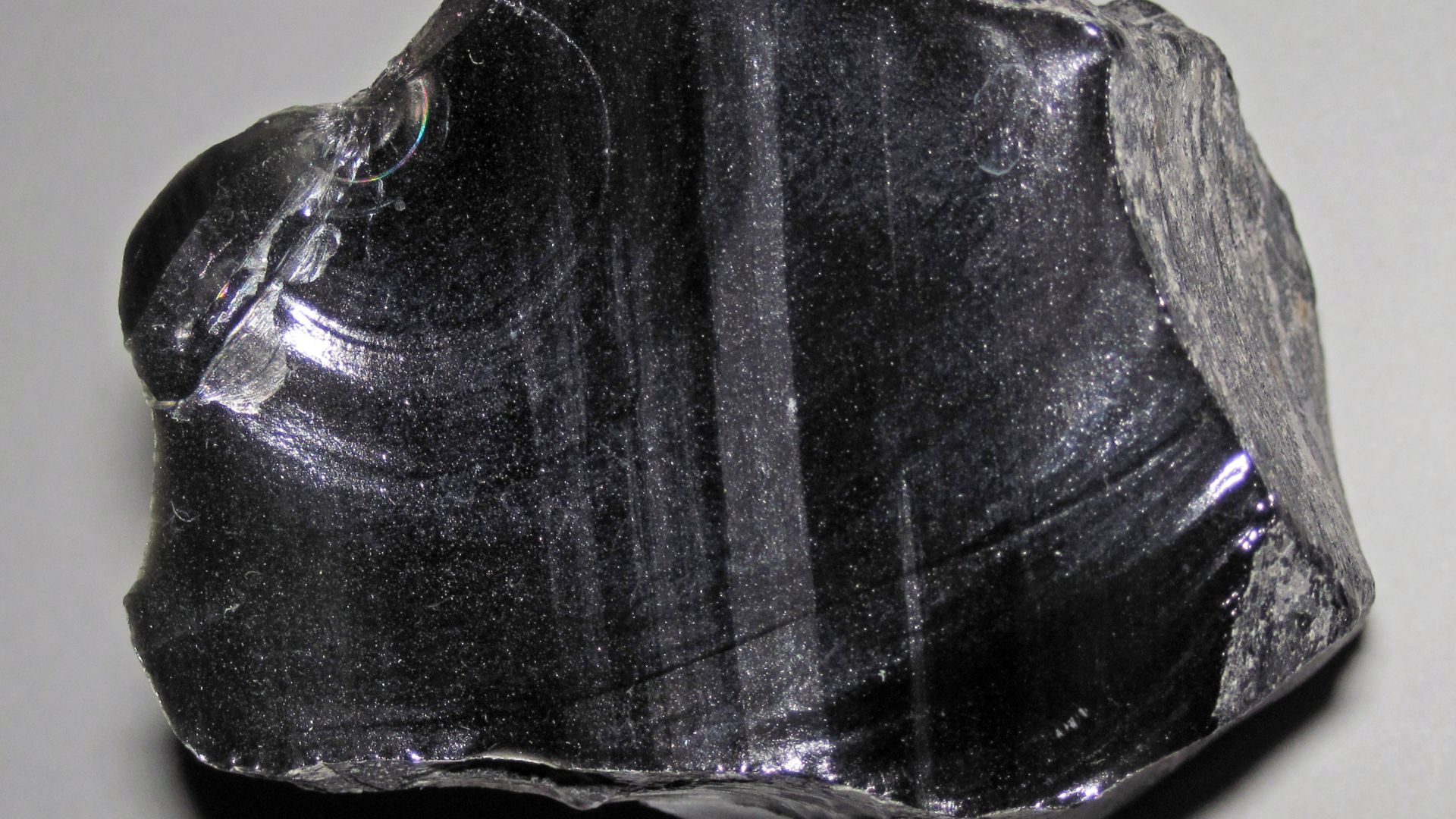 (~5.1 centimeters across at its widest)

Igneous rocks form by the cooling & crystallization of hot, molten rock (magma & lava).  If this happens at or near the land surface, or on the seafloor, they are extrusive igneous rocks.  If this happens deep unde