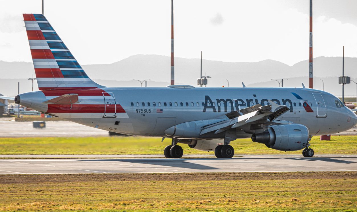 American Airlines airplane on the tarmac during daylight, featuring bright colors and clear aviation details