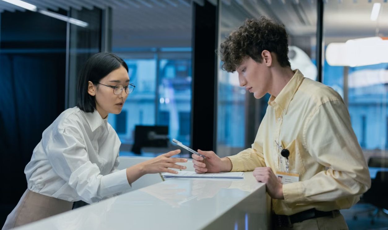 Two professionals discussing at a modern reception