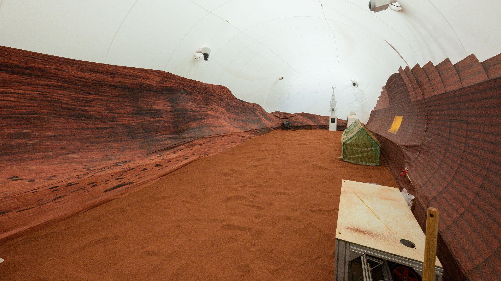NASA’s simulated Mars habitat includes a 1,200-square-foot sandbox with red sand to simulate the Martian landscape. The area will be used to conduct simulated spacewalks or “Marswalks” during the analog missions.
PHOTO DATE:  11-30-22
LOCATION:  Bldg. 220
