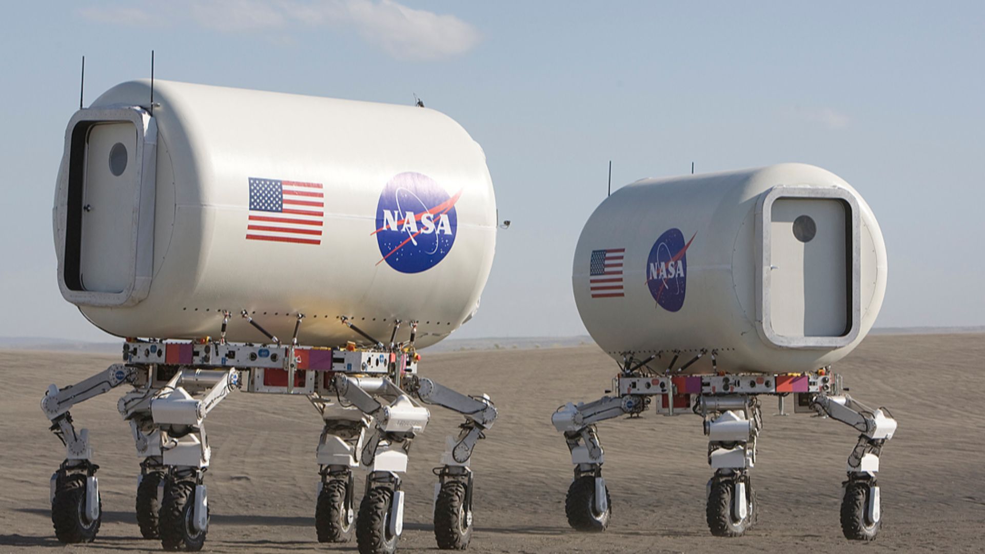 Shown here are two of NASA's ATHLETE robotic rover concepts, each carrying a mockup crew module for use on the Moon or Mars. While these prototypes are less than half the size of the proposed full-size mission rover, they are still about 4 meters (13 feet