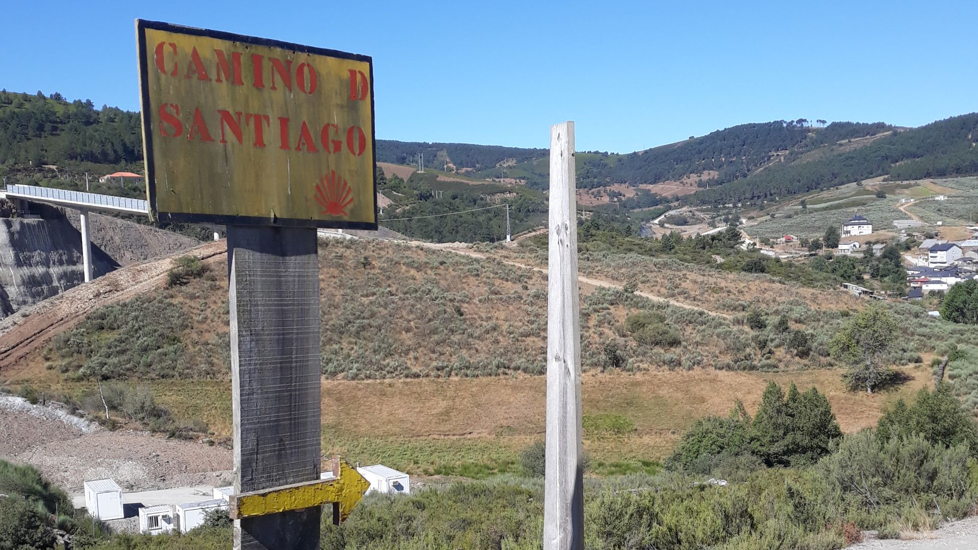 Camino de Santiago (Way of St. James) signs on the Via de Plata/Camino Sanabrés route, approaching Campobecerros. Galicia, Spain.
