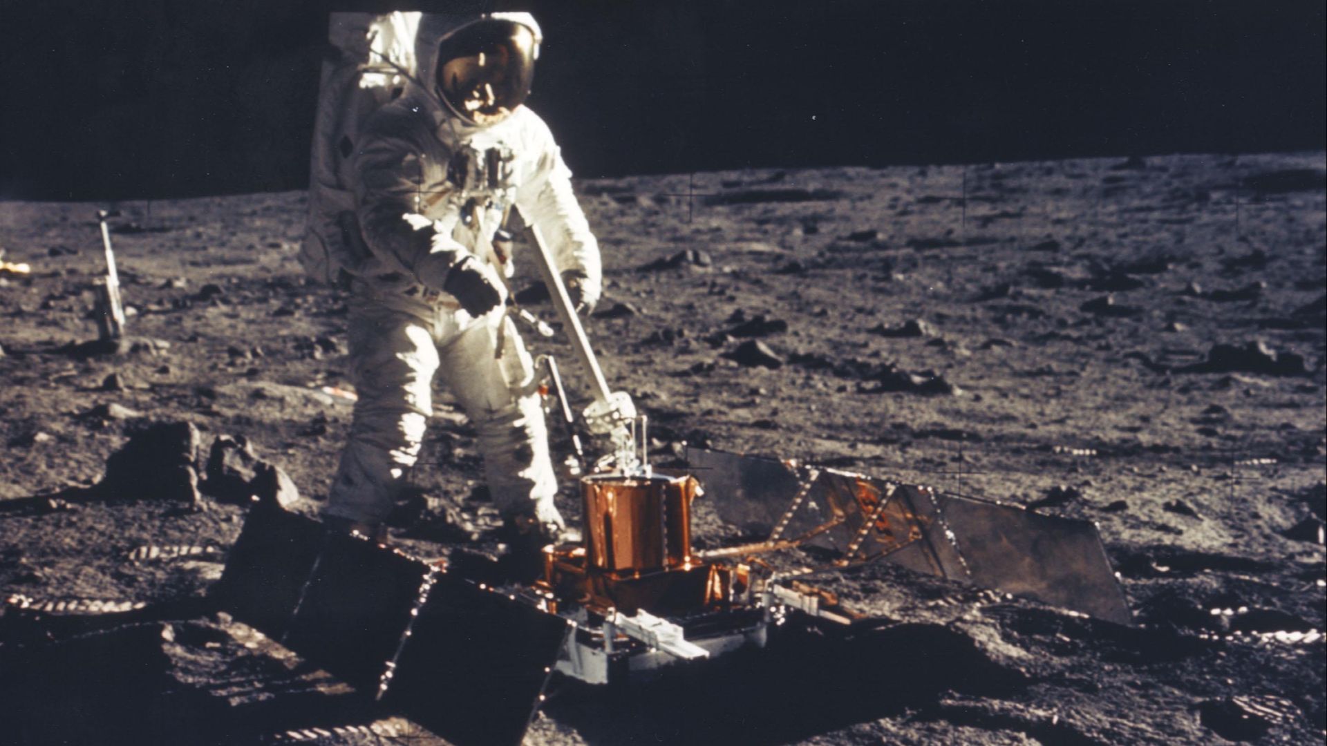 JOHNSON SPACE CENTER, HOUSTON, TEXAS - Apollo 11 Lunar Module Pilot Edwin E. Aldrin Jr. deployes the Passive Seismic Experiment Package (PSE) on the Moon's surface near Tranquility Base. The sensitive instrument remained behind on the lunar surface to rad