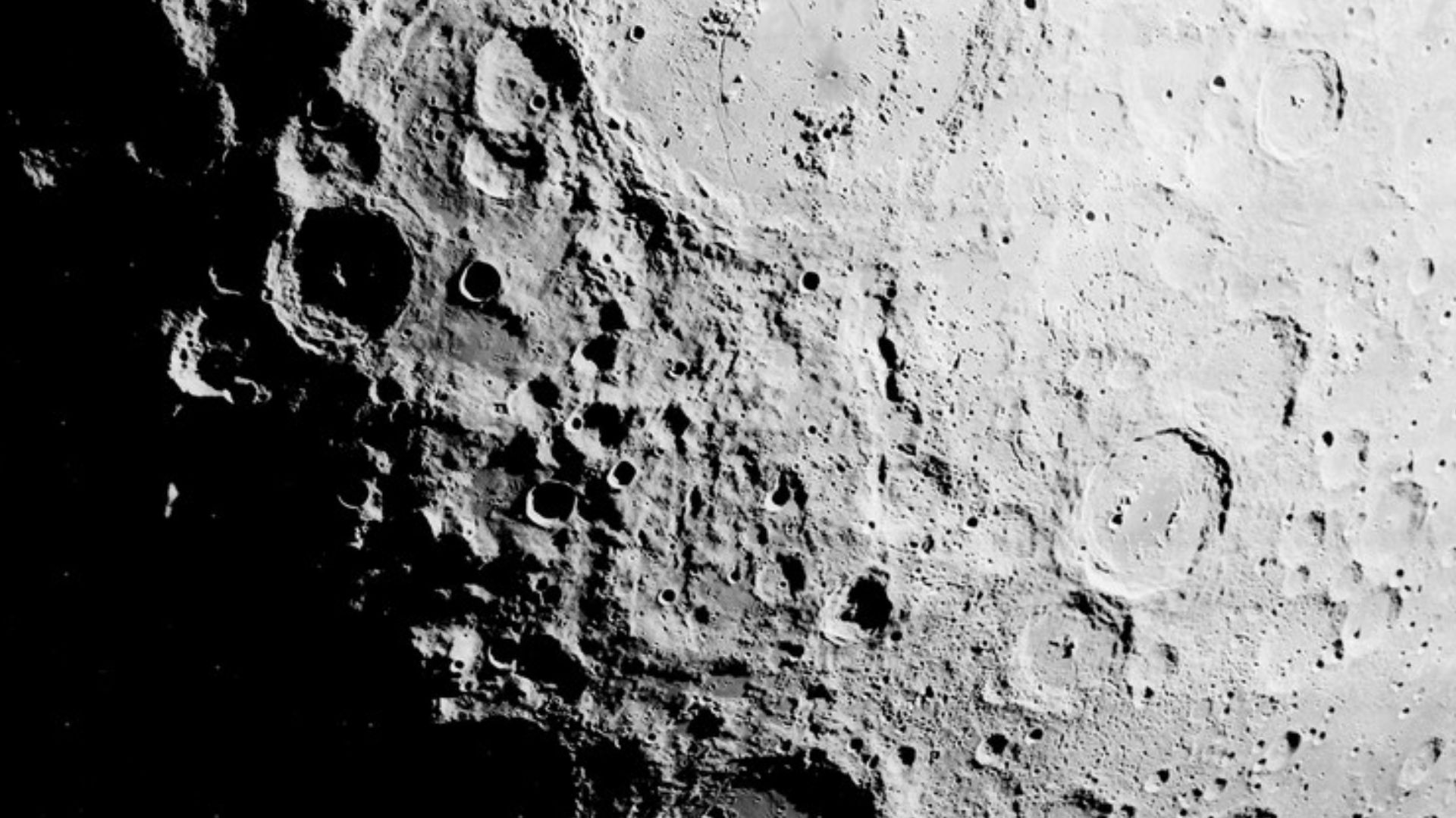 Schrödinger crater at center, near the south pole of the moon. Vallis Planck extends from the crater to the upper right of center, and Vallis Schrödinger is to the upper left of center, going through Sikorsky.  The south pole itself is in lower left, in s