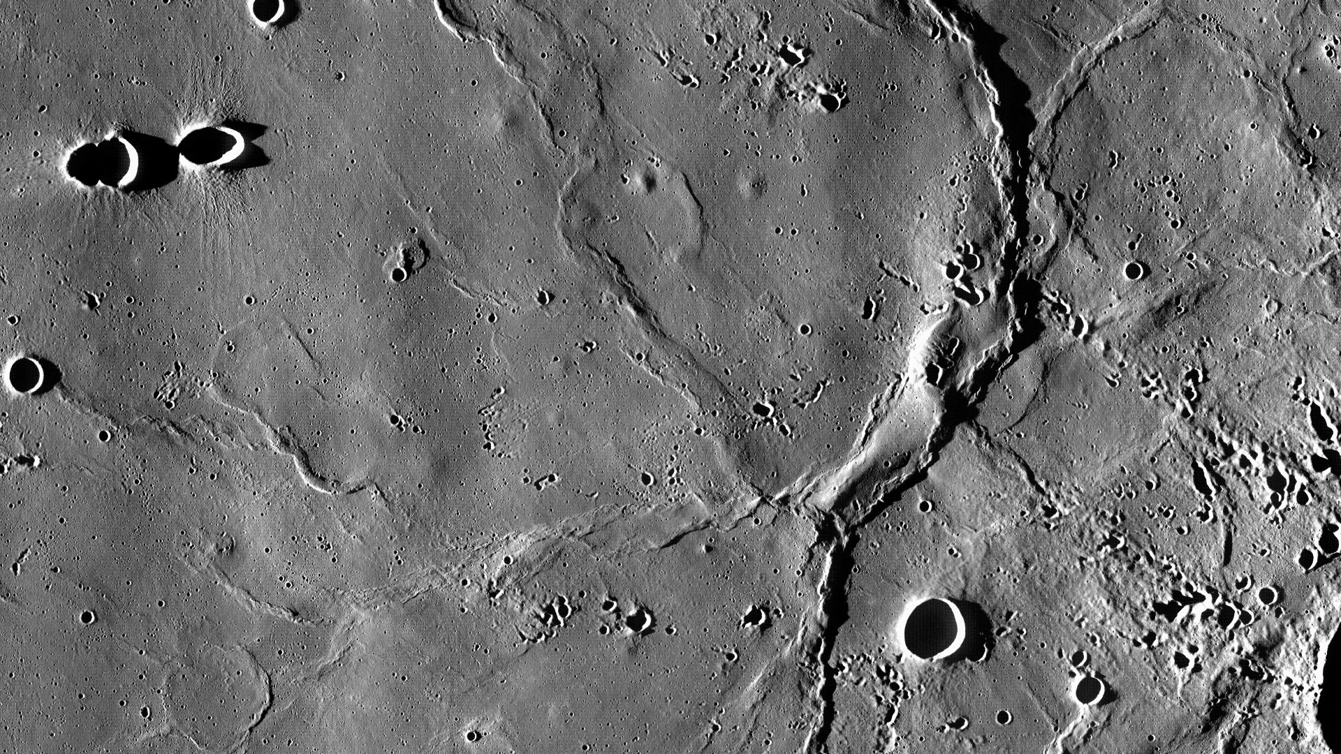 Bow of wrinkle ridges, called Dorsa Geikie, near the center of Mare Fecunditatis on the Moon. According to some suggestions, it can outline the submerged inner ring of Fecunditatis basin (e.g., Wilhelms, 1987, Wood, 2010). Craters Messier A and Messier ar
