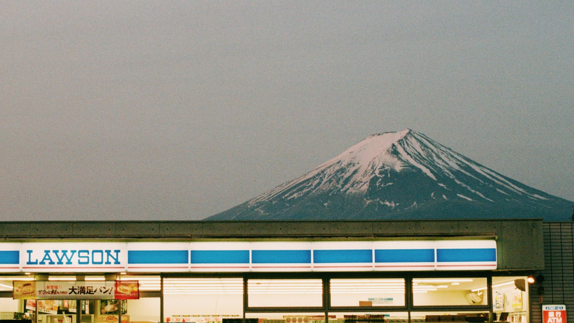 Lawson store with mount fuji in the background.
