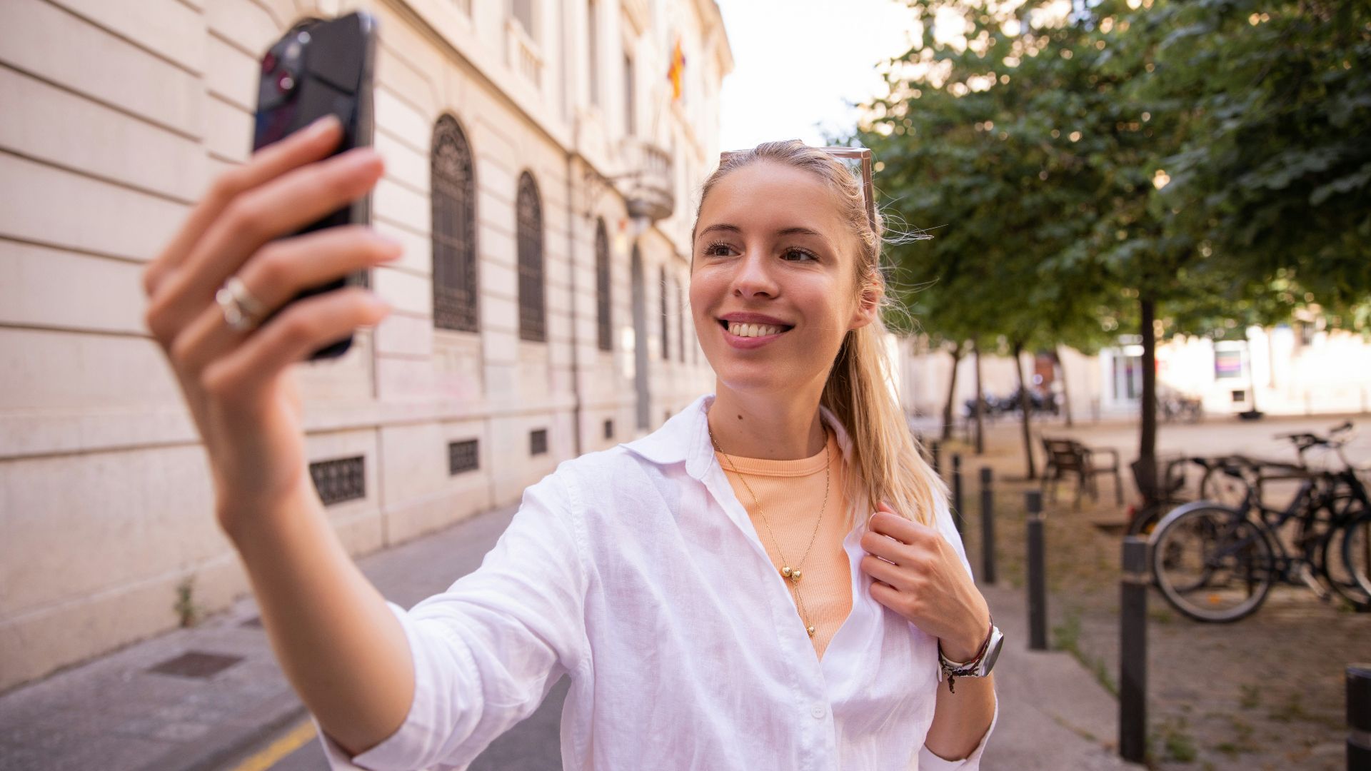 a woman taking a picture with her cell phone