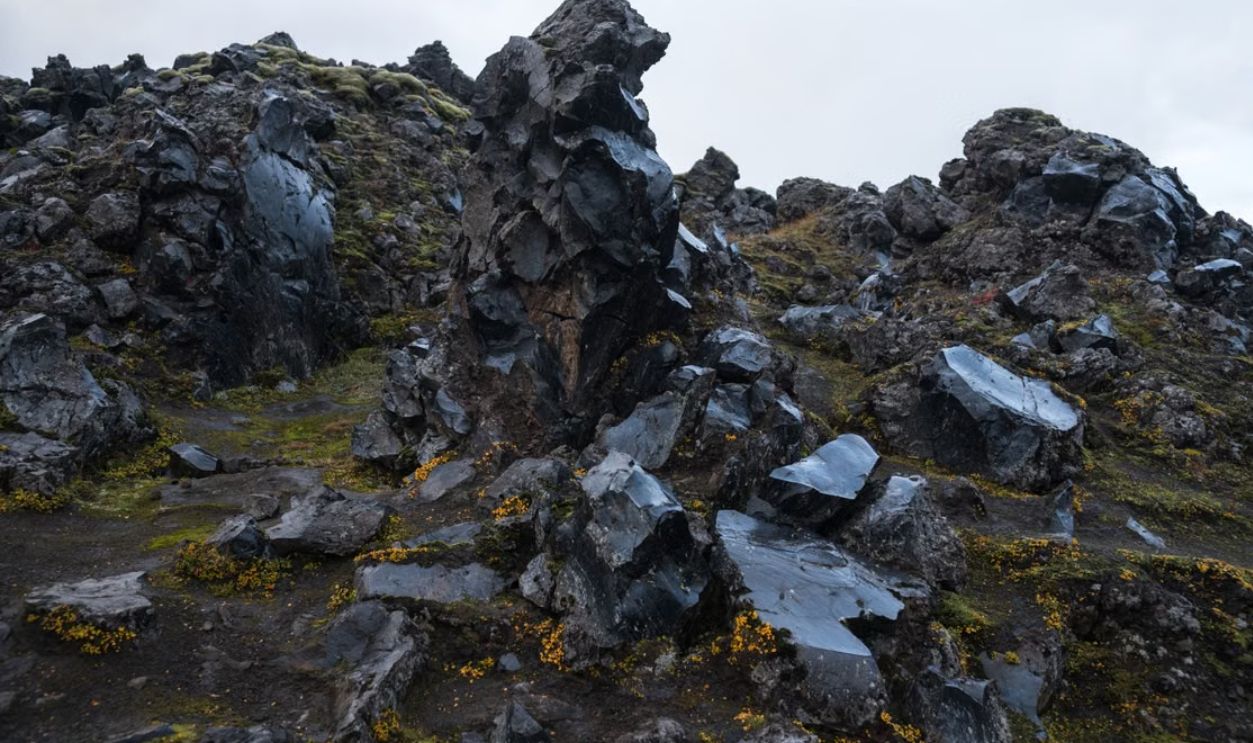Captivating view of volcanic rock formations with moss in Iceland's rugged terrain